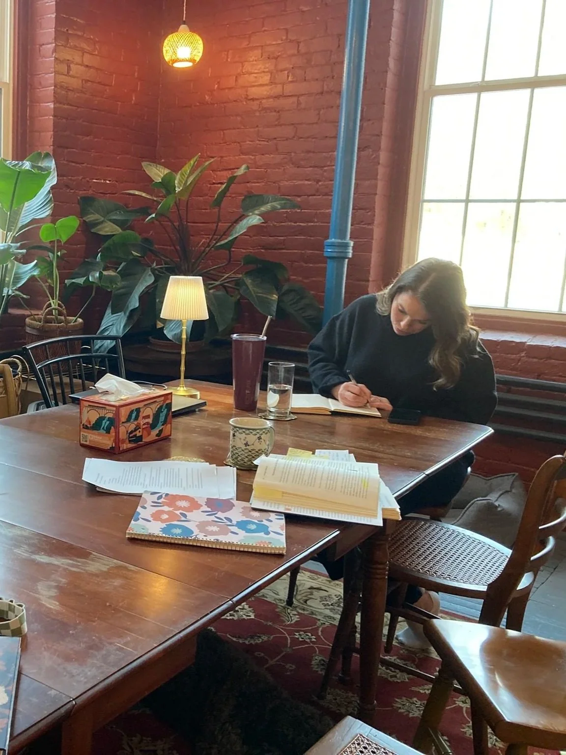 woman journaling at a desk