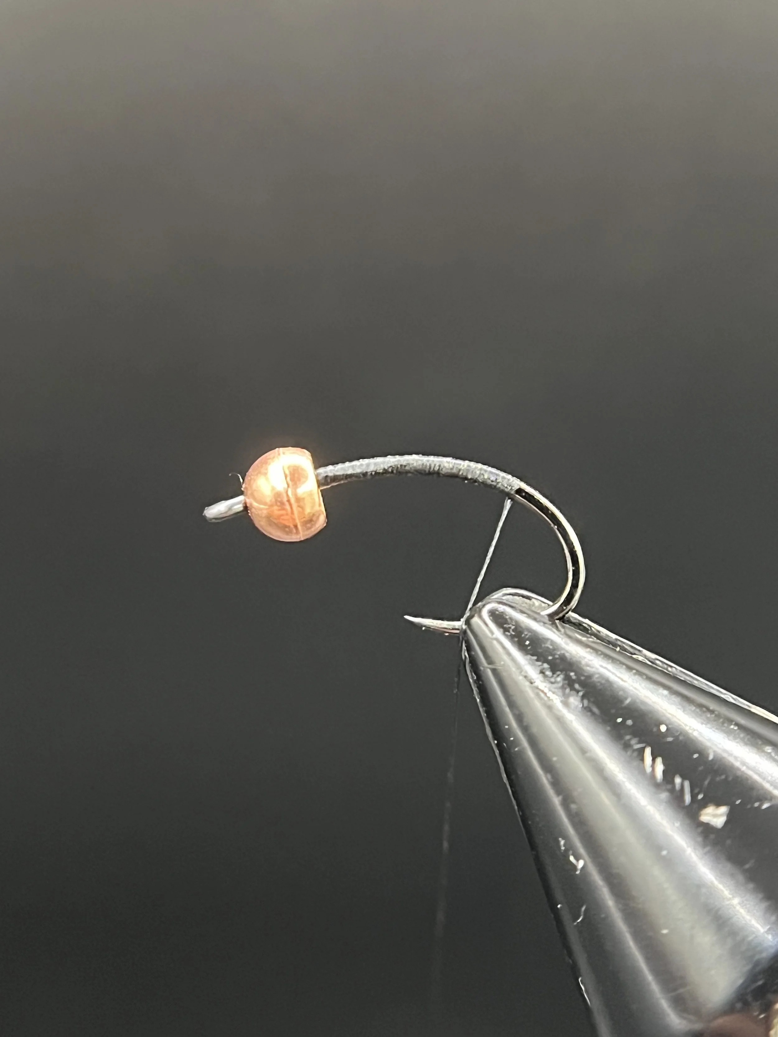 Start the thread at the bead and wrap back to the hook bend