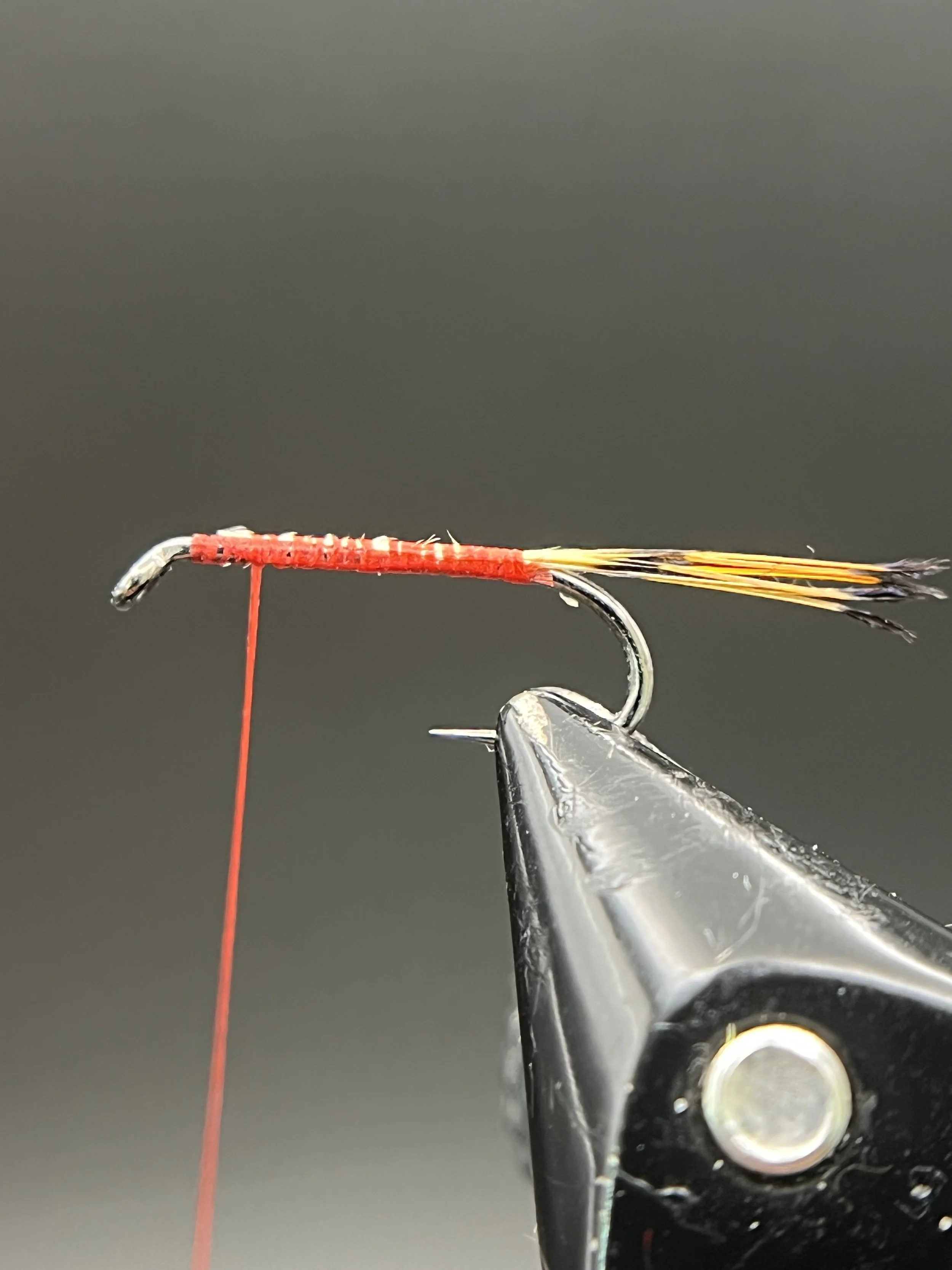 Cut a small bunch of tippet fibers and attach as a tail