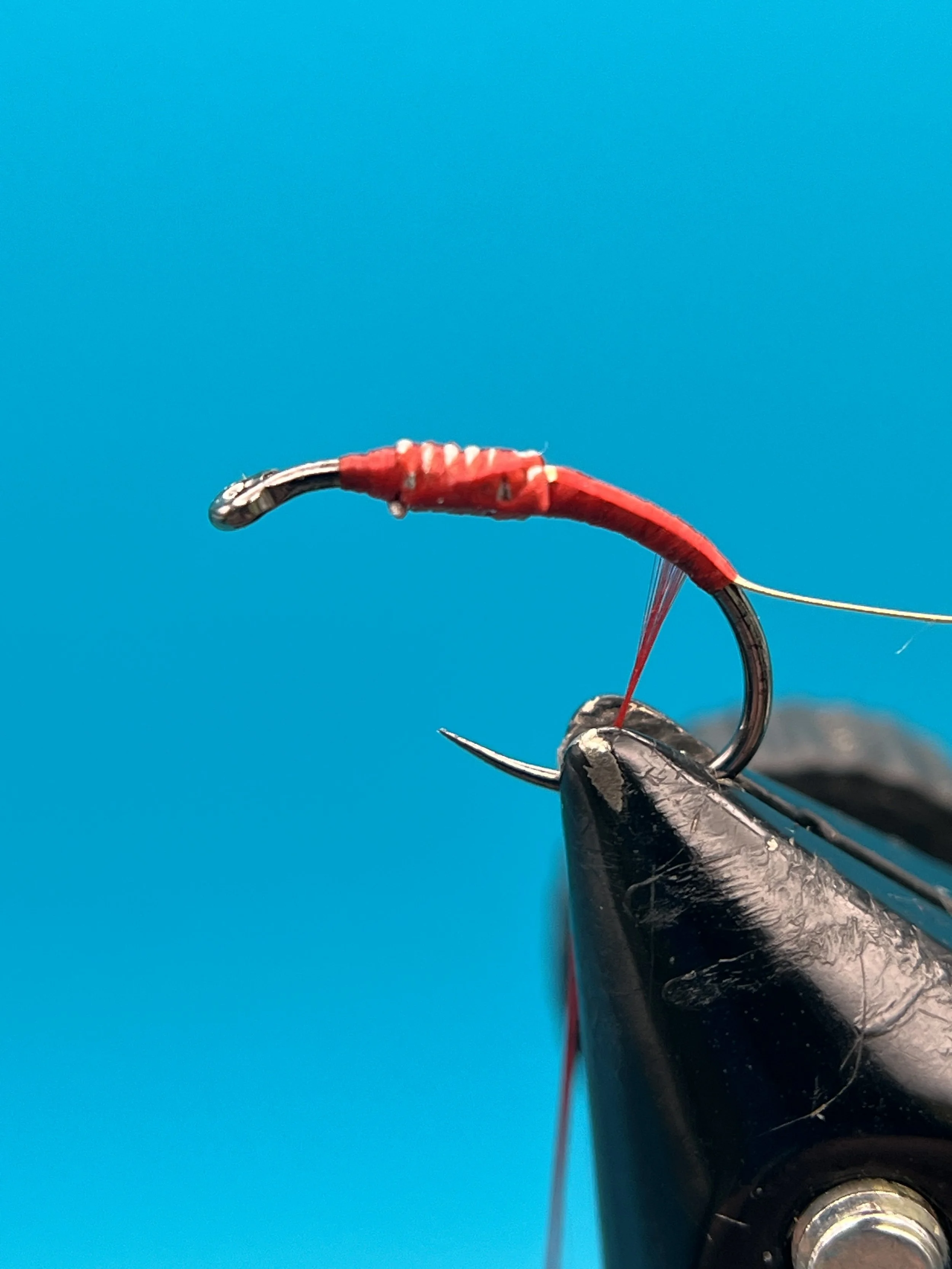 Attach a piece of wire off the bend of the hook
