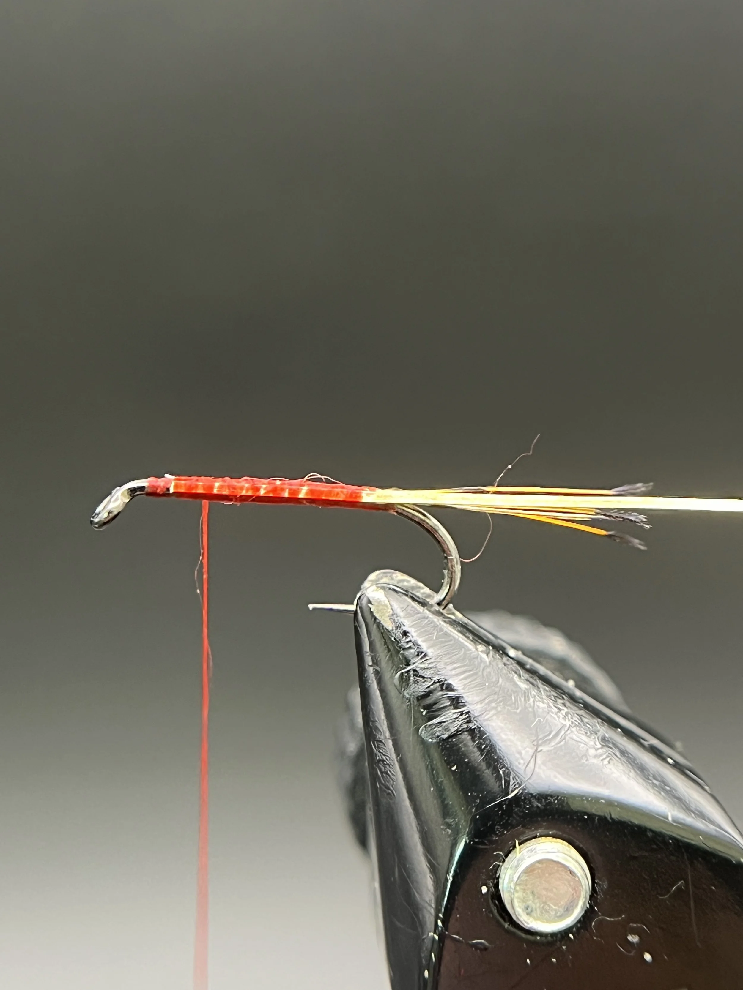Tie in a length of wire for the rib