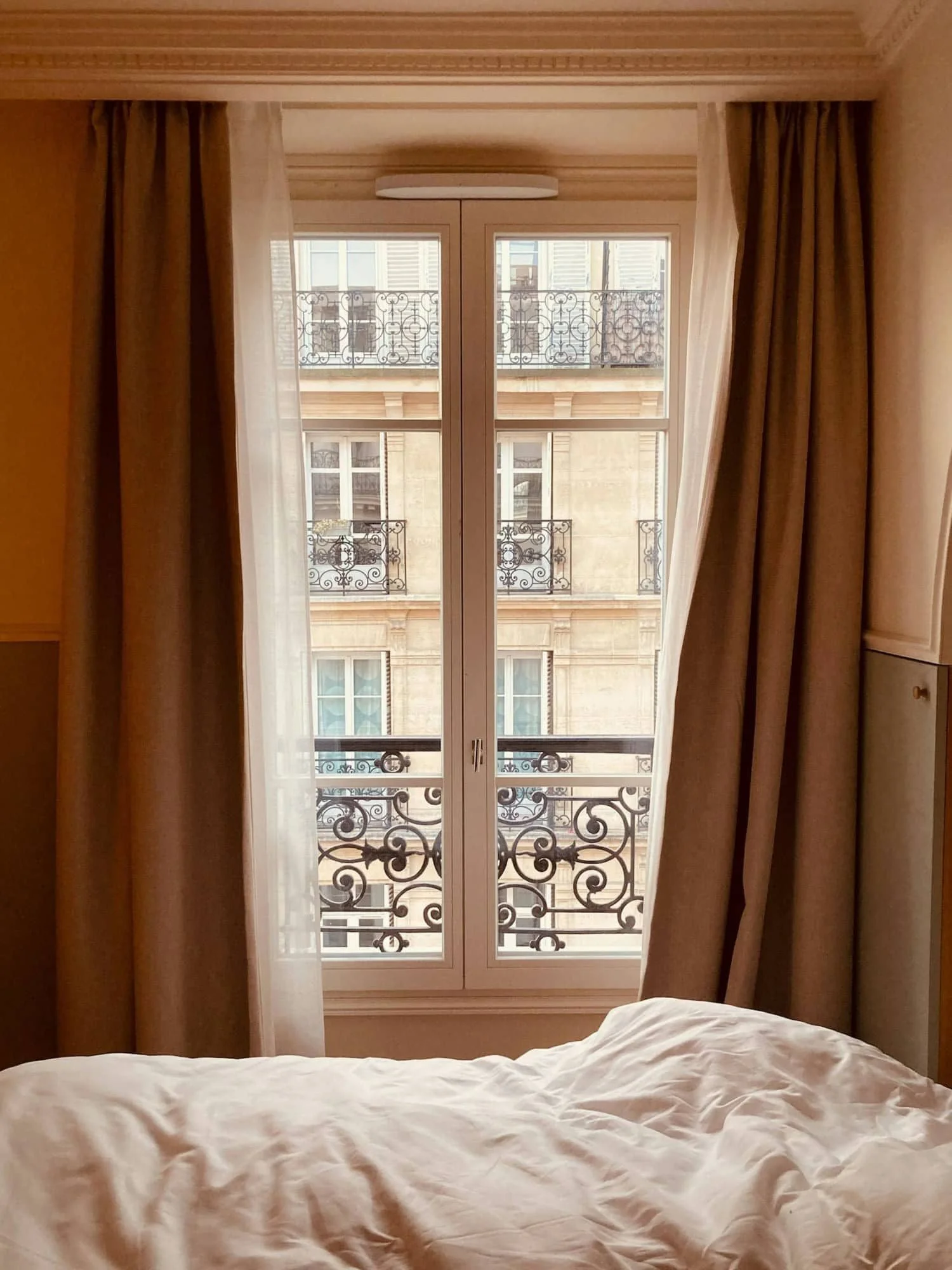 bed in front of a window