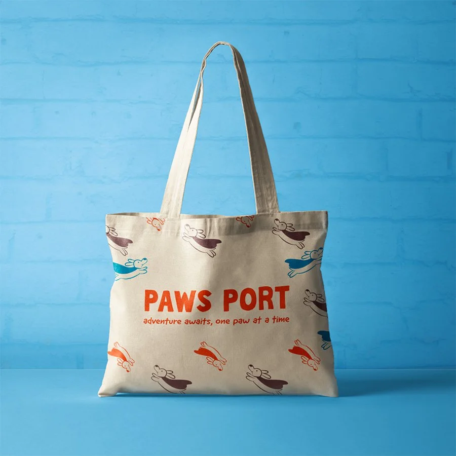 PawsPort branded tote bag featuring playful logo and travel-inspired design for pet lovers on the go.