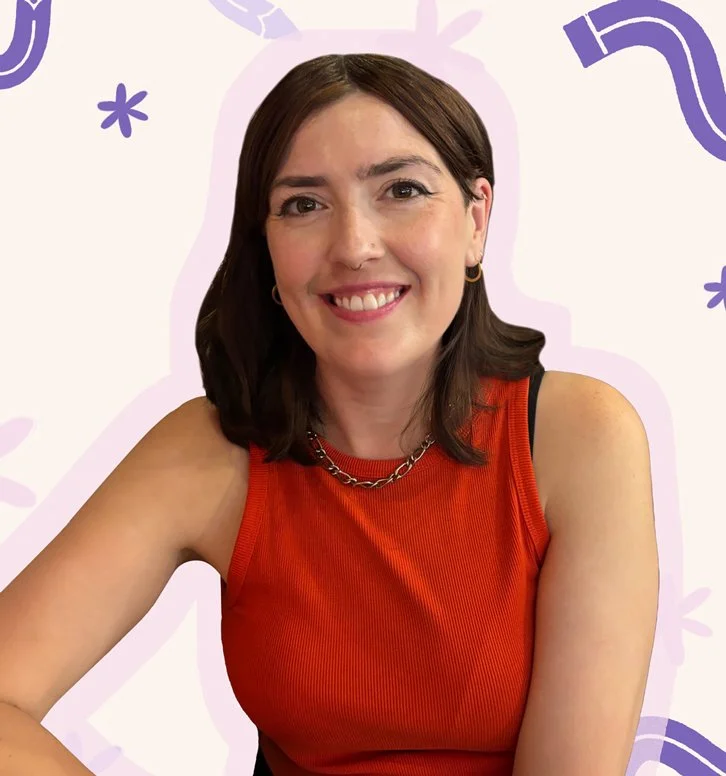 A woman with shoulder-length brown hair, wearing a red sleeveless top and a silver chain necklace, smiling at the camera against a playful purple and white background.