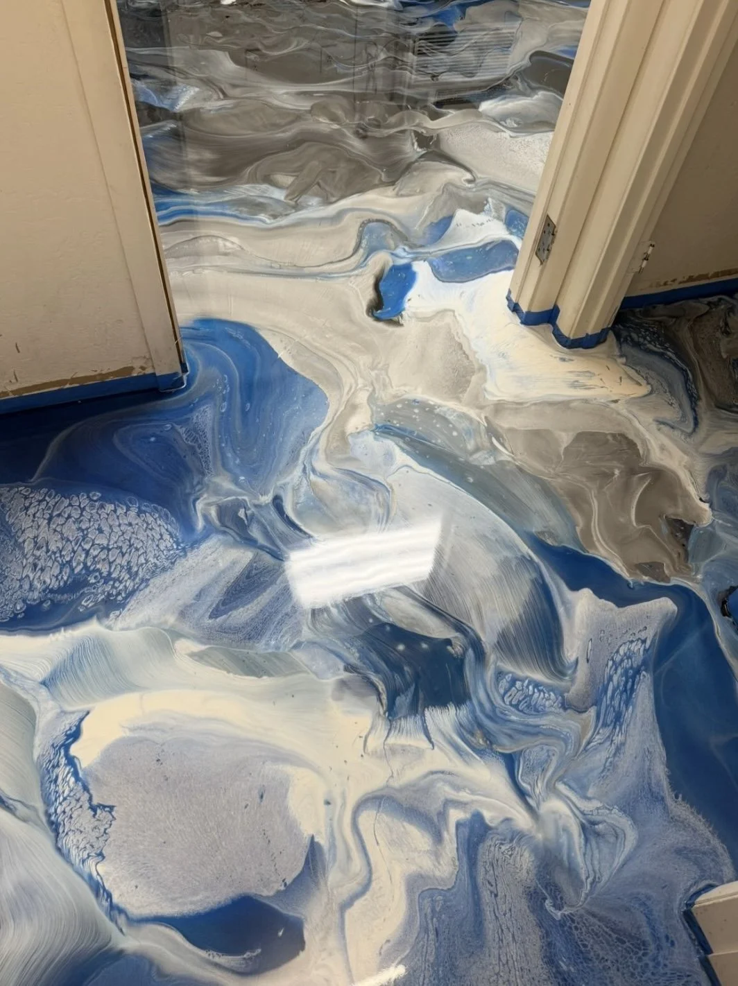 Close-up of a polished marble floor with dark veining.