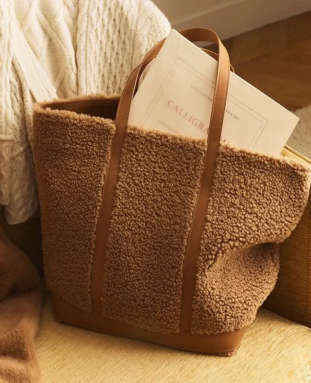 Like a hug, in bag form 🧸⁠
⁠
Plush shearling meets sleek leather in the @vanessabruno Cabas Bag&mdash;a cozy classic, reimagined.