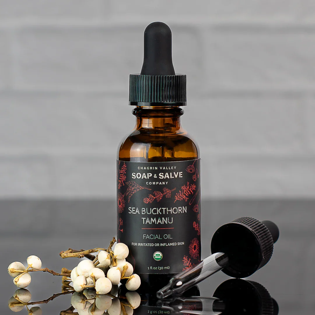 Sea buckthorn and tamanu facial oil in glass dropper bottle