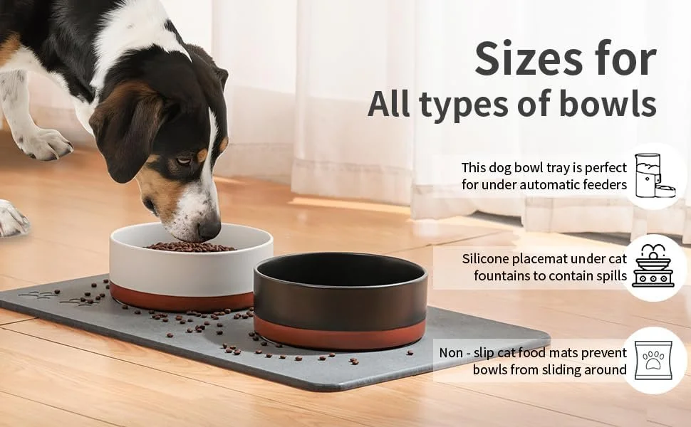 Dog eating out of bowl on top of stone mat