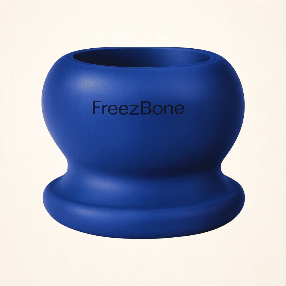 Blue silicone device labeled 'FreezBone' with a rounded, textured surface.