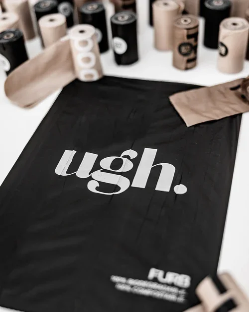 Compostable dog poop bags variety pack with modern black and nude designs