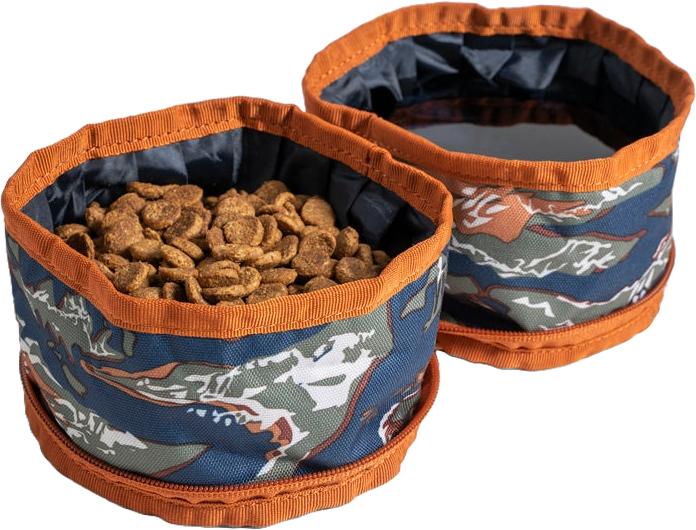 Two foldable fabric bowls with orange trim, one filled with dog food pellets.