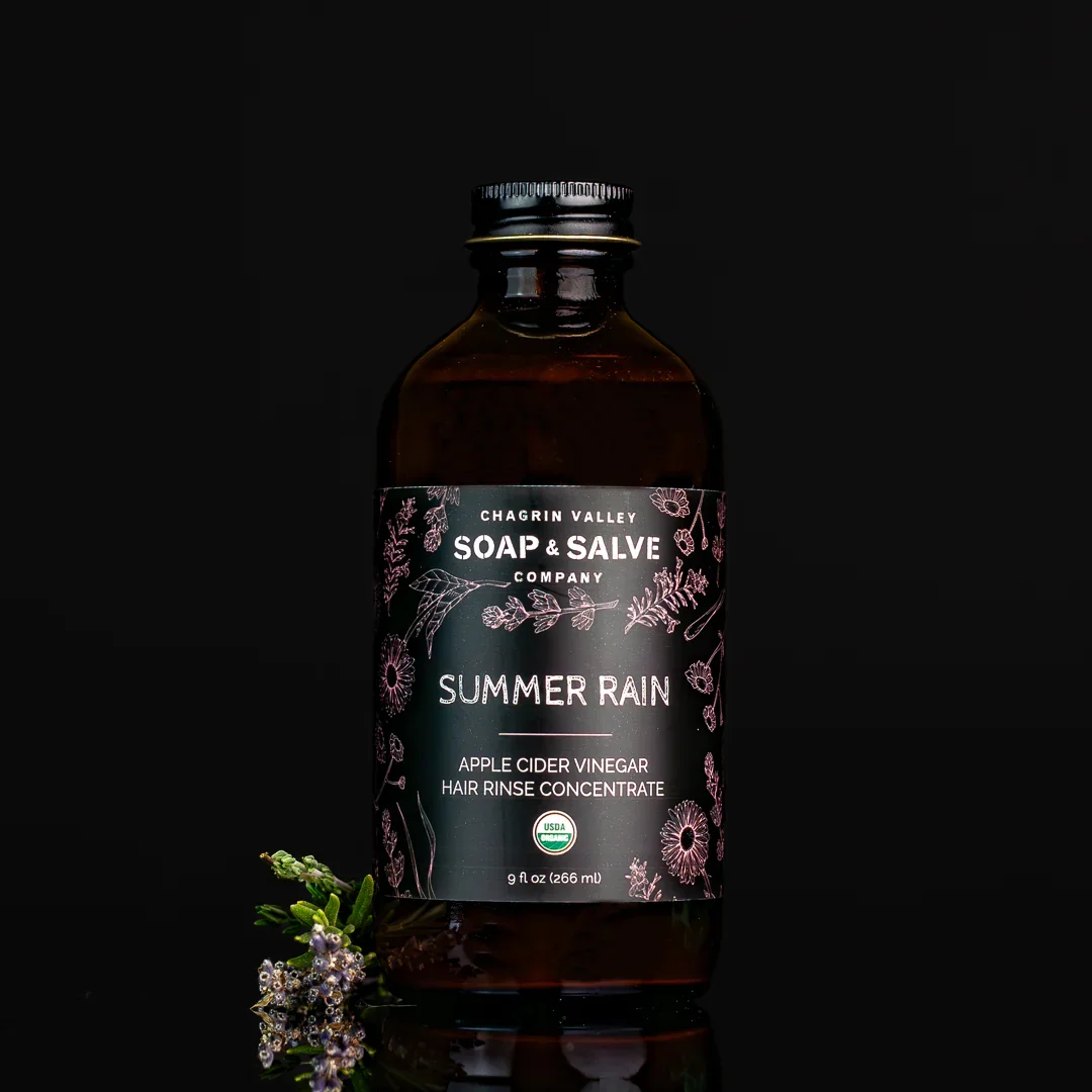 Organic apple cider vinegar hair rinse concentrate in glass bottle