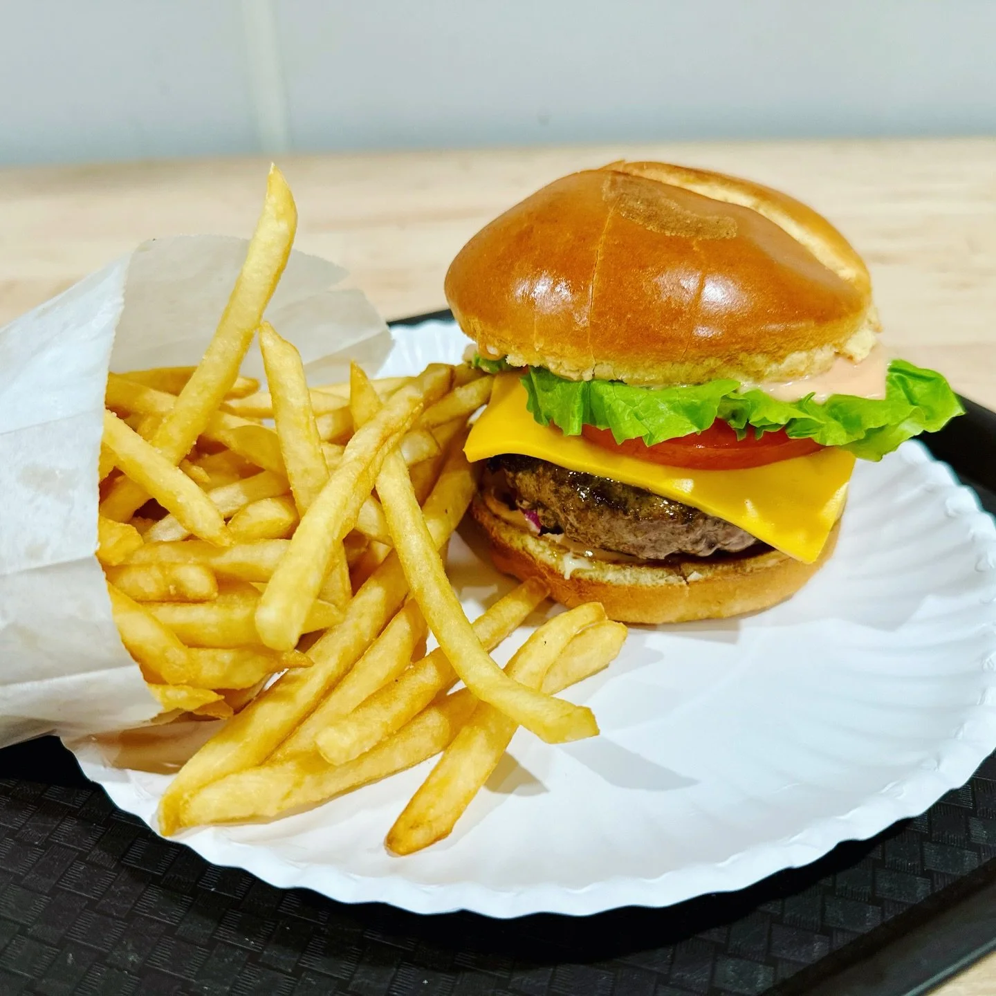 The classic&mdash;leveled up. 🍔🔥

A fresh Wagyu blend patty, melted cheese, crisp lettuce, tomato, pickles, onions, and our signature sauce&hellip; with fries on the side.

Simple. Juicy. Done right.

🍔 Wagyu blend burger
🍟 Golden fries
📍 Grand 
