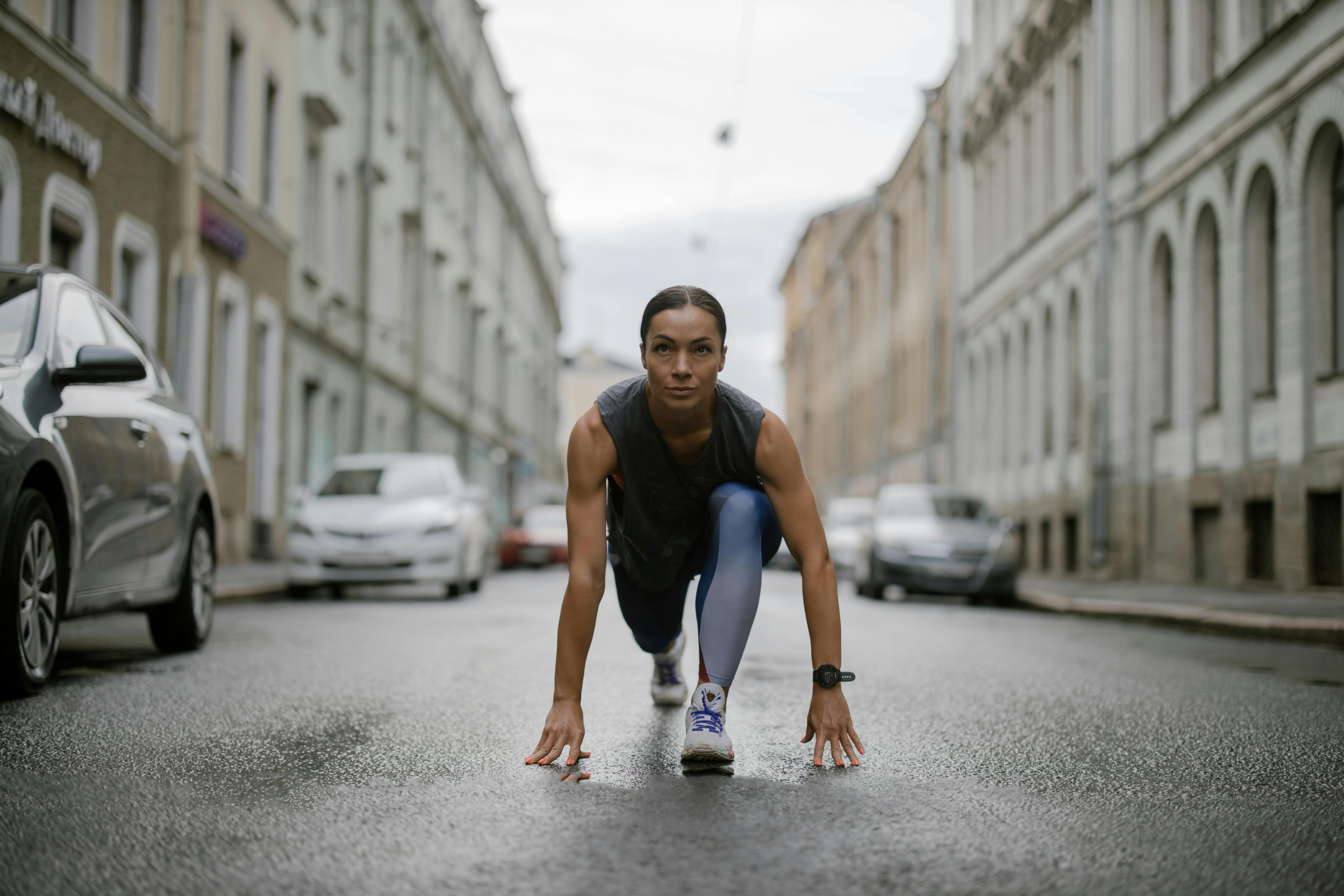 Woman in ready position to start a running race by @cottonbro
