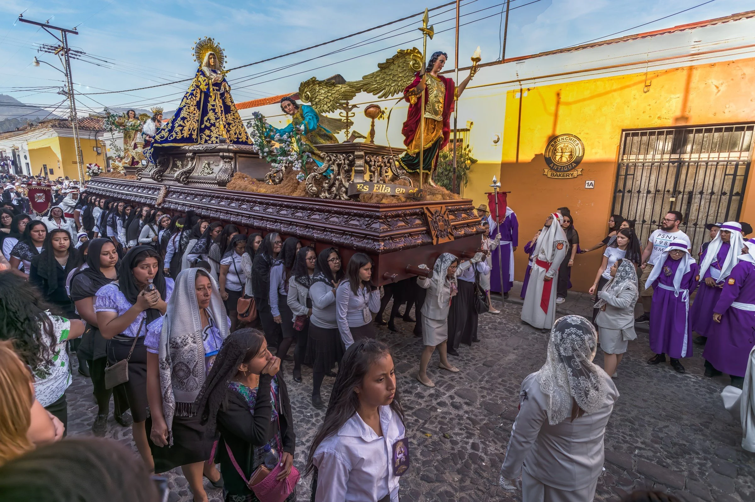Women known as "cargadoras" carry the Float of the Virgin Mary