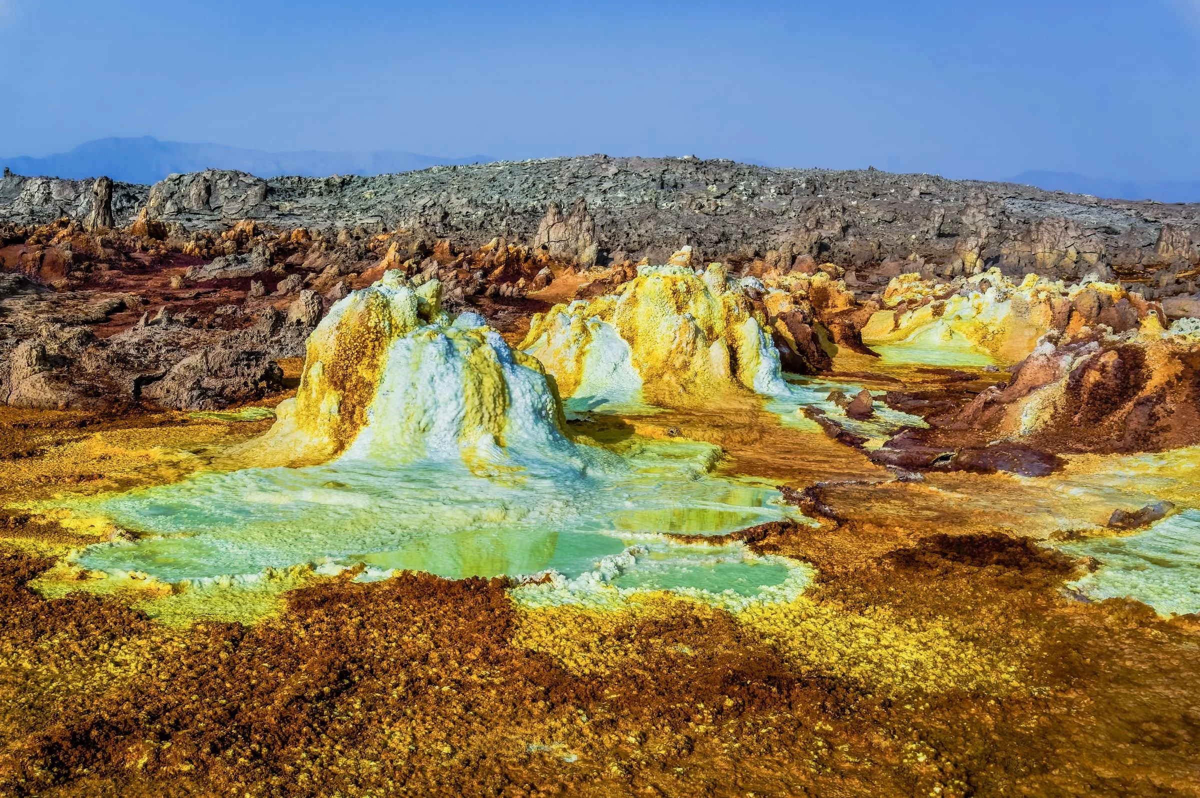 Dallol Volcanic hydrothermal field, acidic hot springs spewing salt, sulfur, and iron oxide minerals