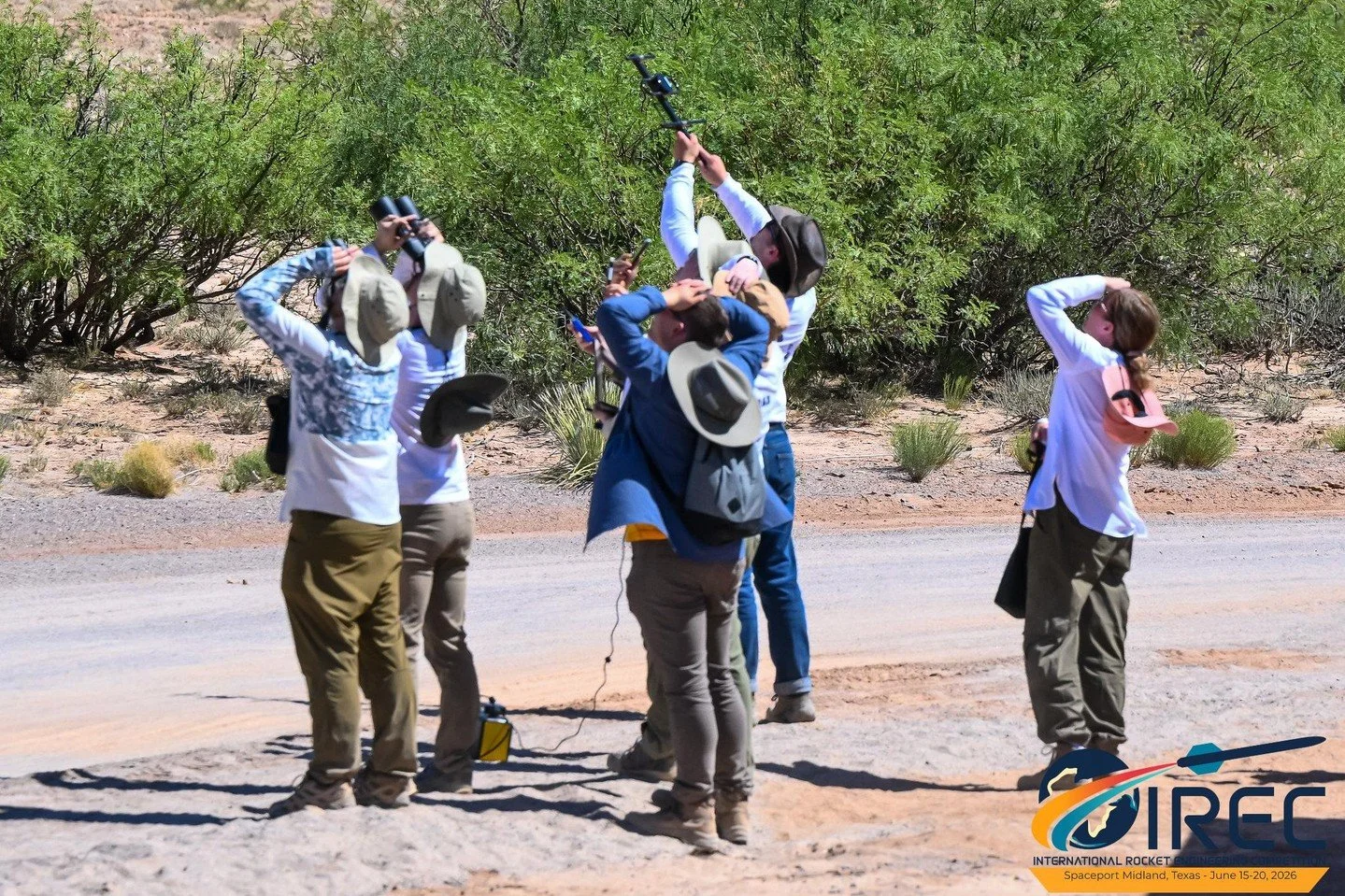 ESRA Archive "2024 IREC Rocket Tracking" photo by Jim Wilkerson. This is a perfect "What to wear to IREC photo" with wide brimmed hats, long sleeve shirts, lightweight pants, and boots.