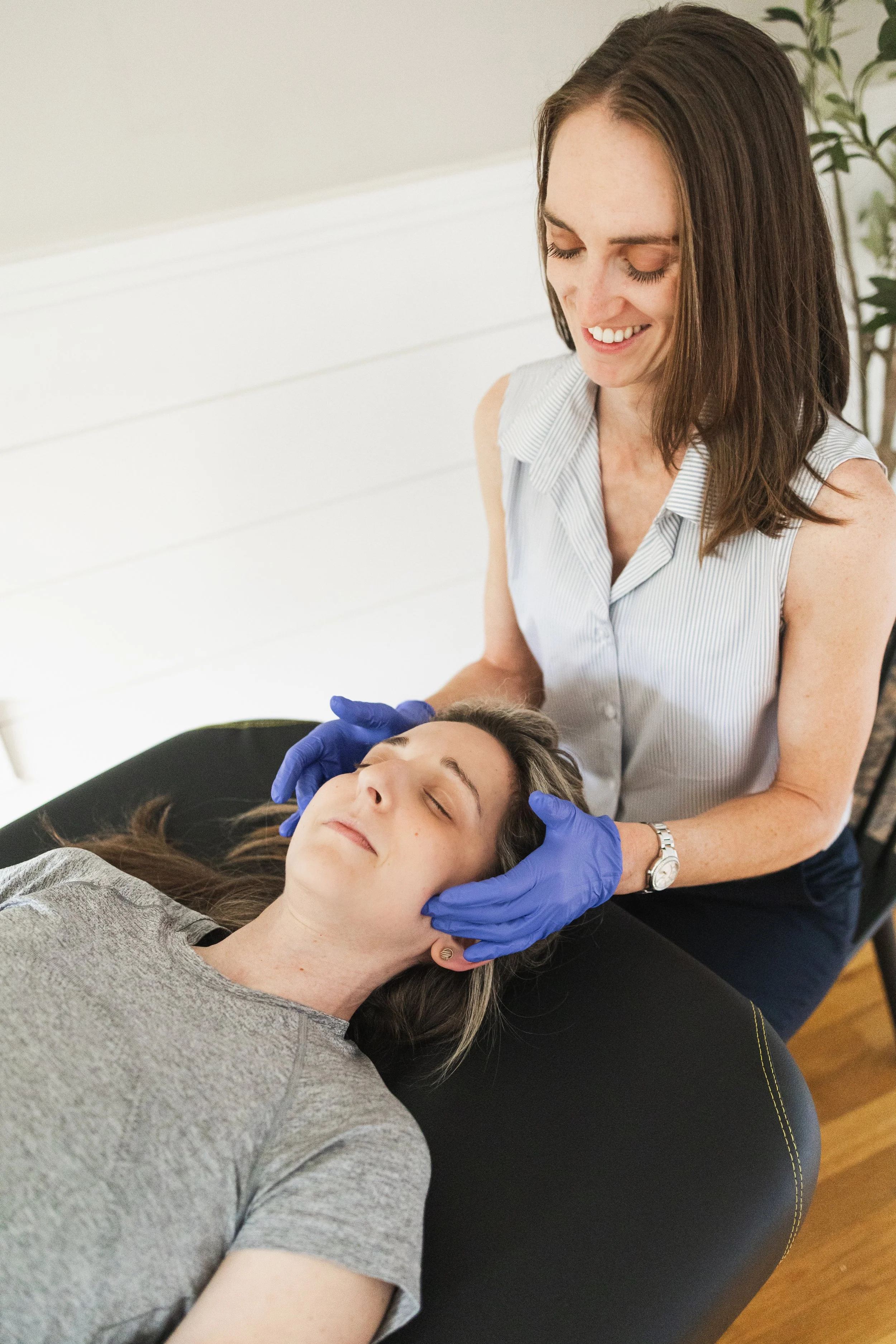 Dr. Julia Cross, physical therapist, provides hands on treatment in south shore office.