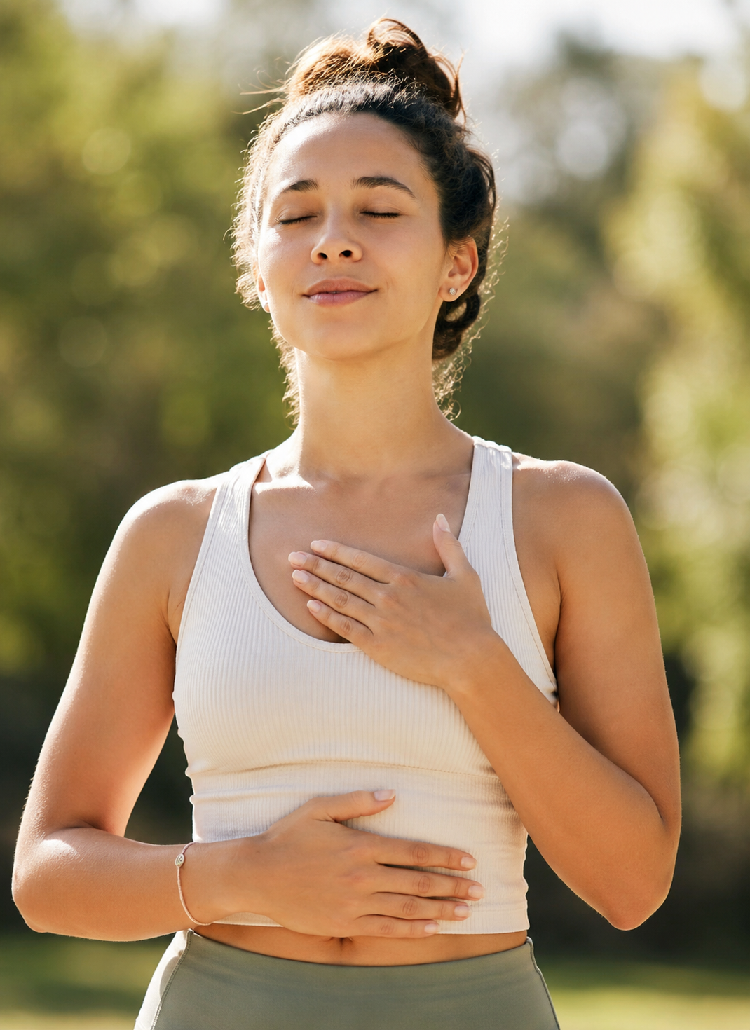 A woman engaging in breathwork practice focused on building a foundation for movement, core stability, and pressure management.