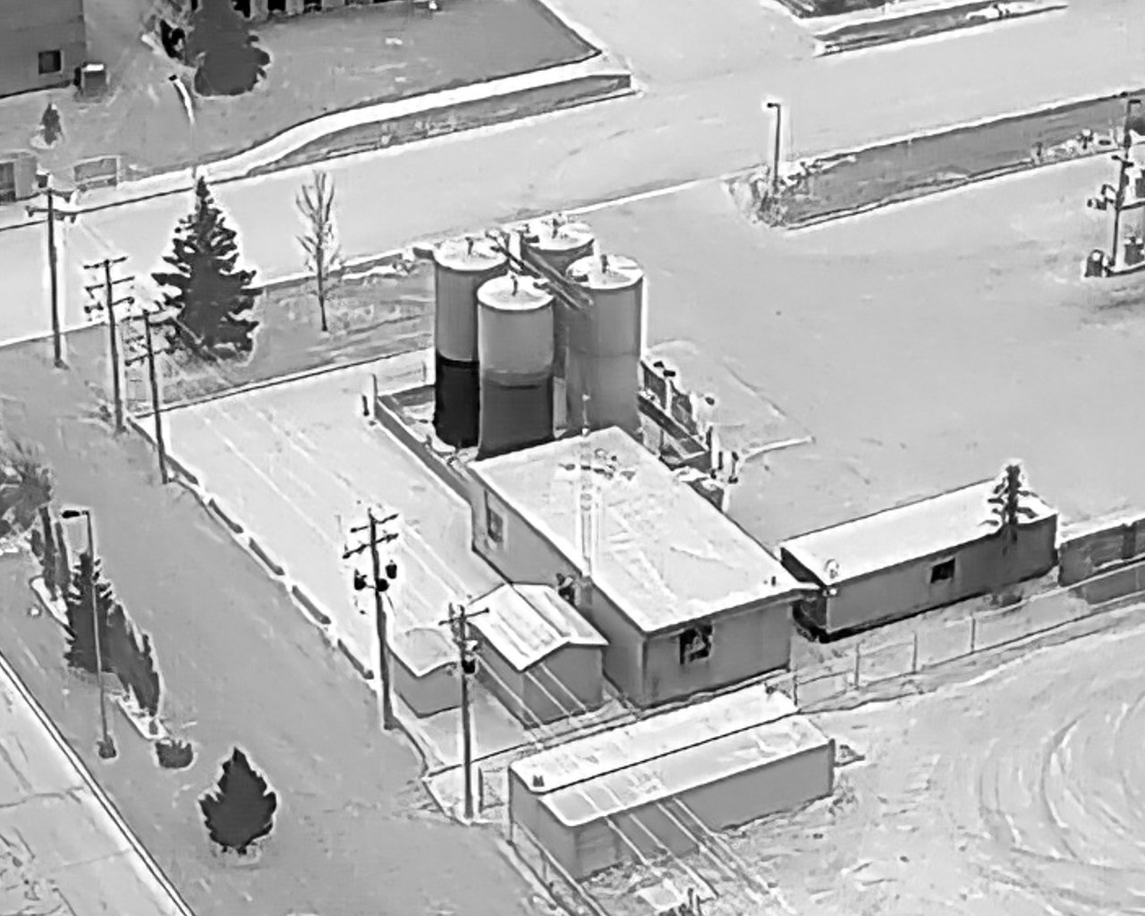 Thermal image of an industrial tank site showing estimated fluid tank levels to support spill prevention monitoring.