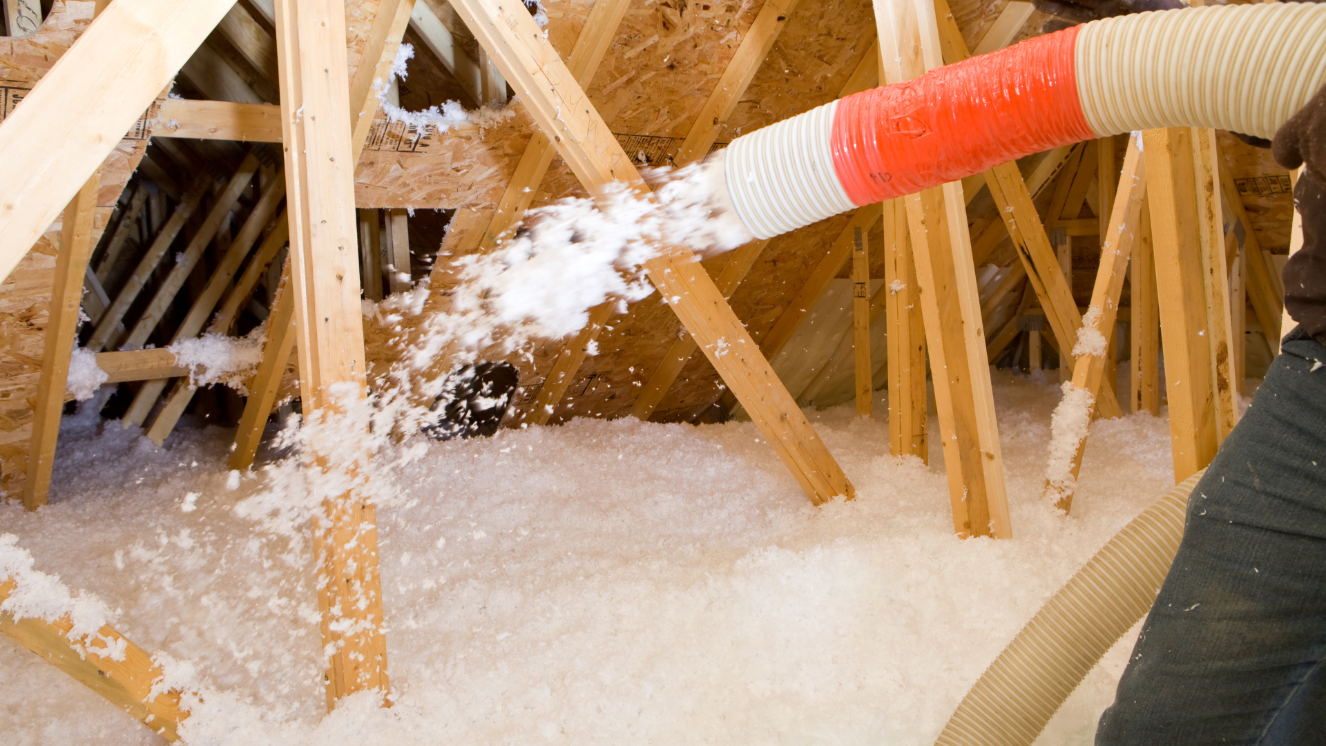 Blown in insulation for attic being installed by Climate Express Heating & Air in New Braunfels, Texas