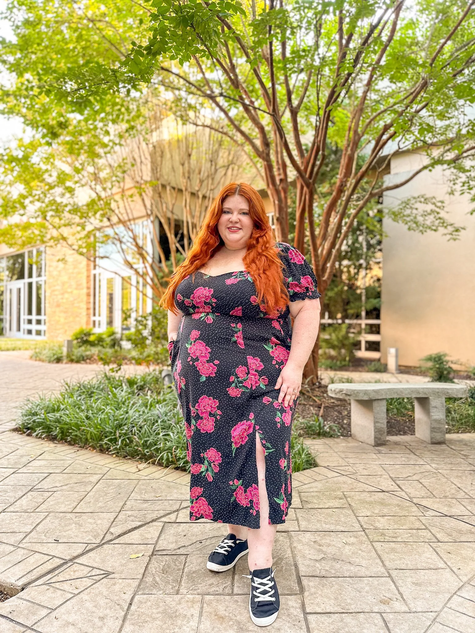 Plus size woman in a black floral dress