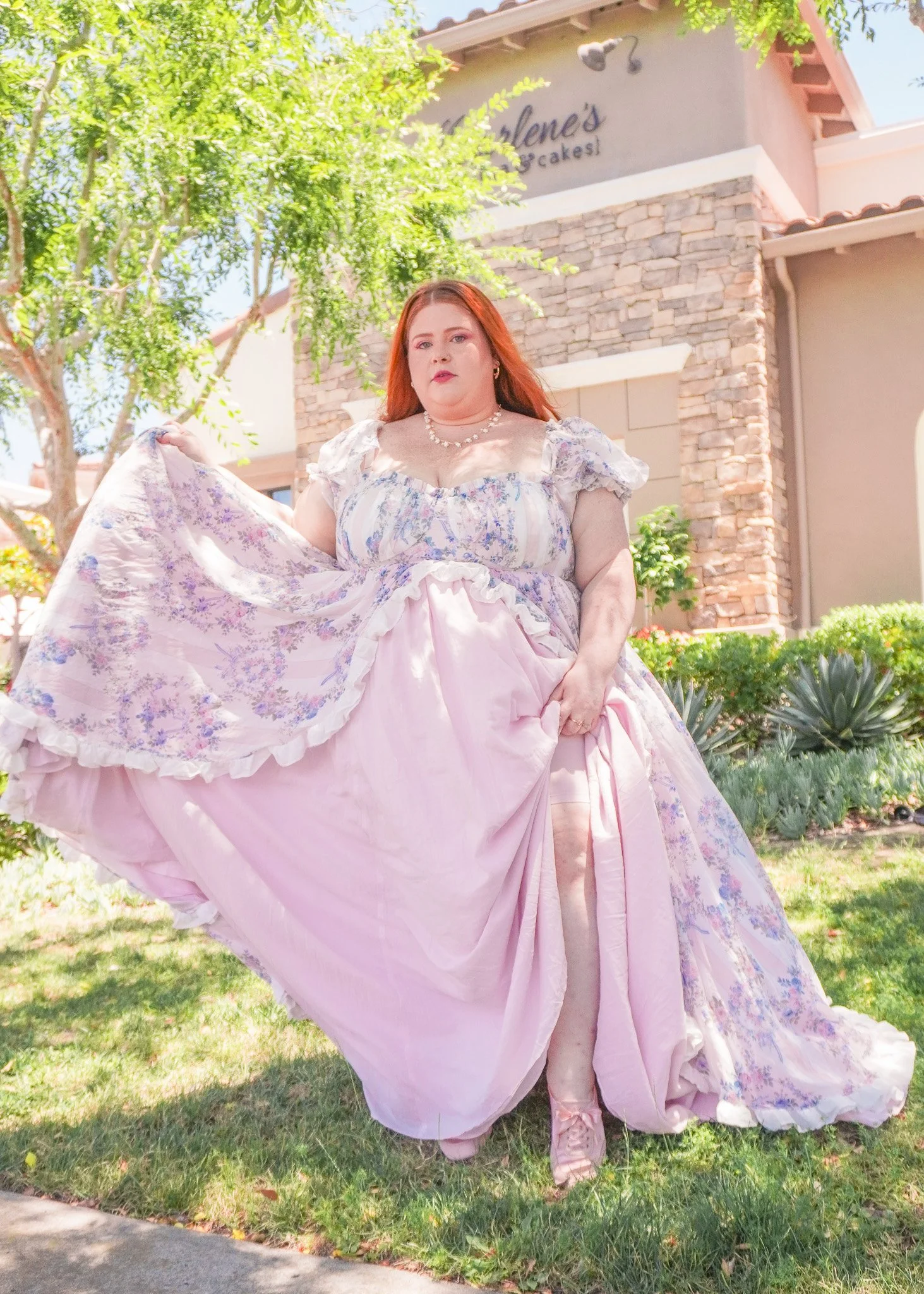 Plus Size woman lifting up her gown to show her anti-chafing shorts.