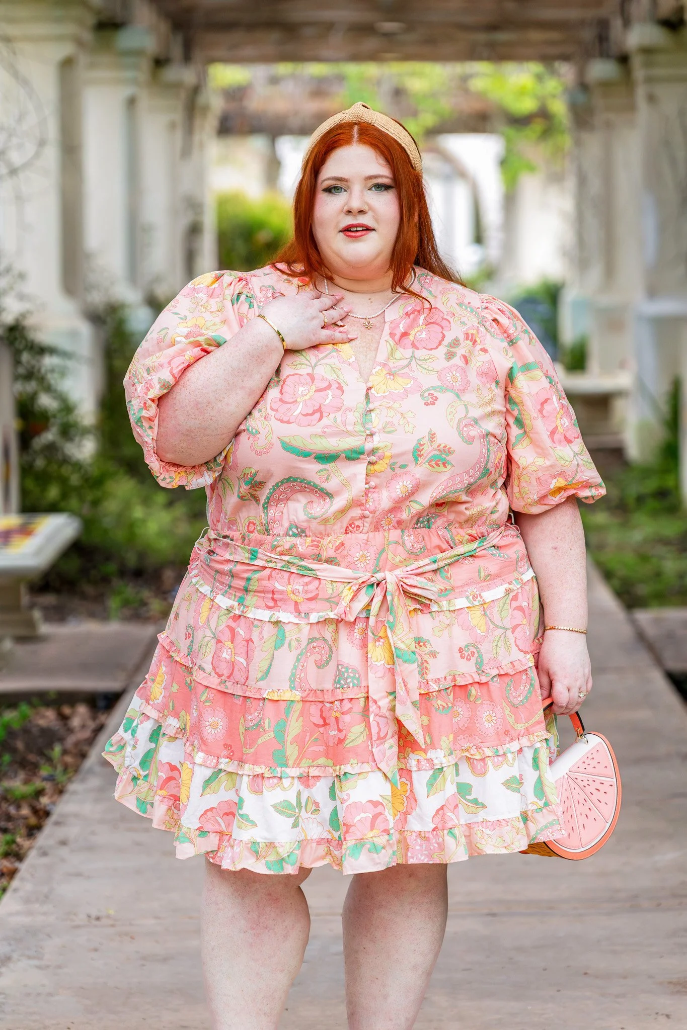 Plus size woman wearing a button down mini dress