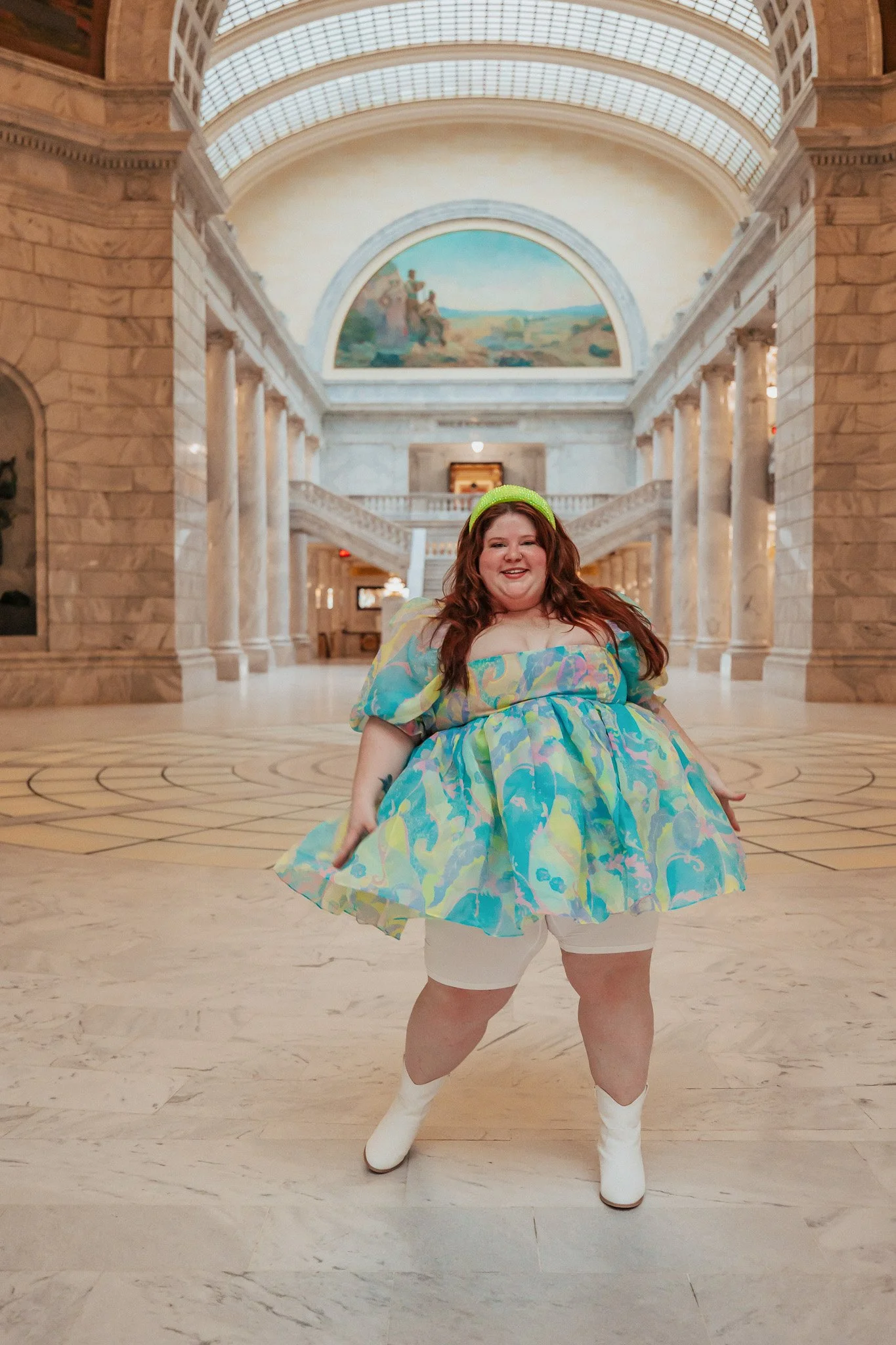 Plus Size woman wearing a short dress with anti-chafing shorts showing.