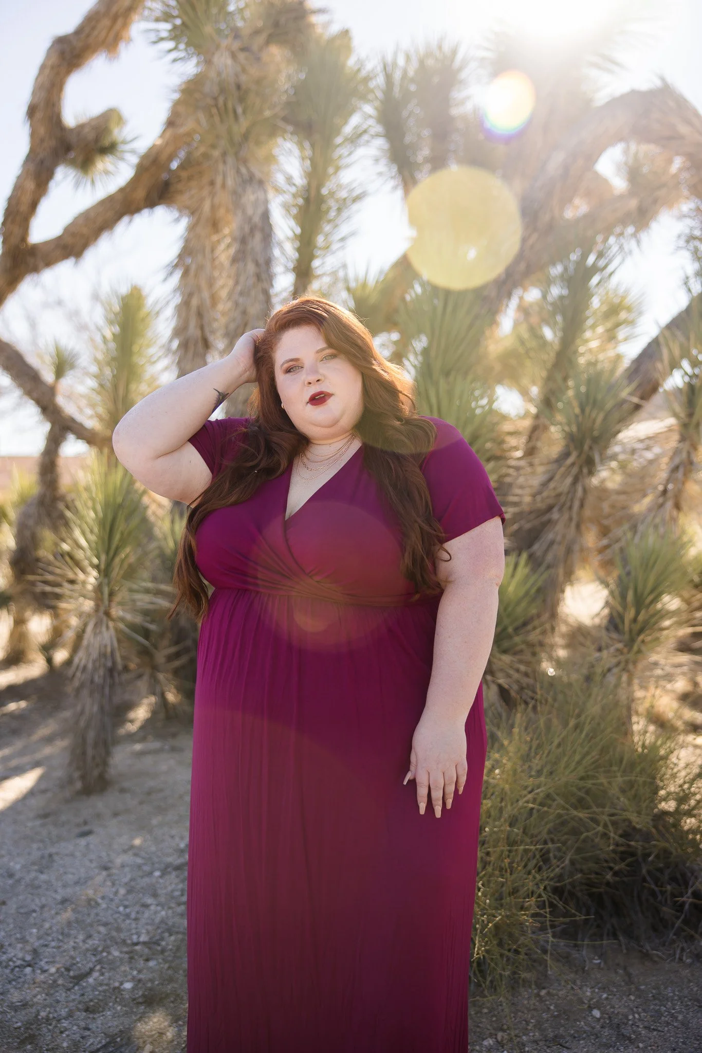 Plus size woman wearing a faux wrap dress in the desert