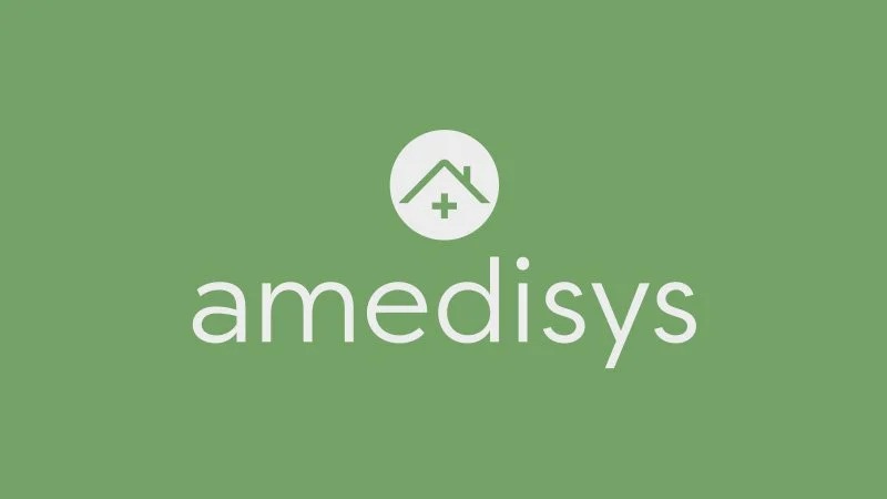 A green background with a white house icon with a medical cross inside, above the word 'amedisys' in lowercase letters.