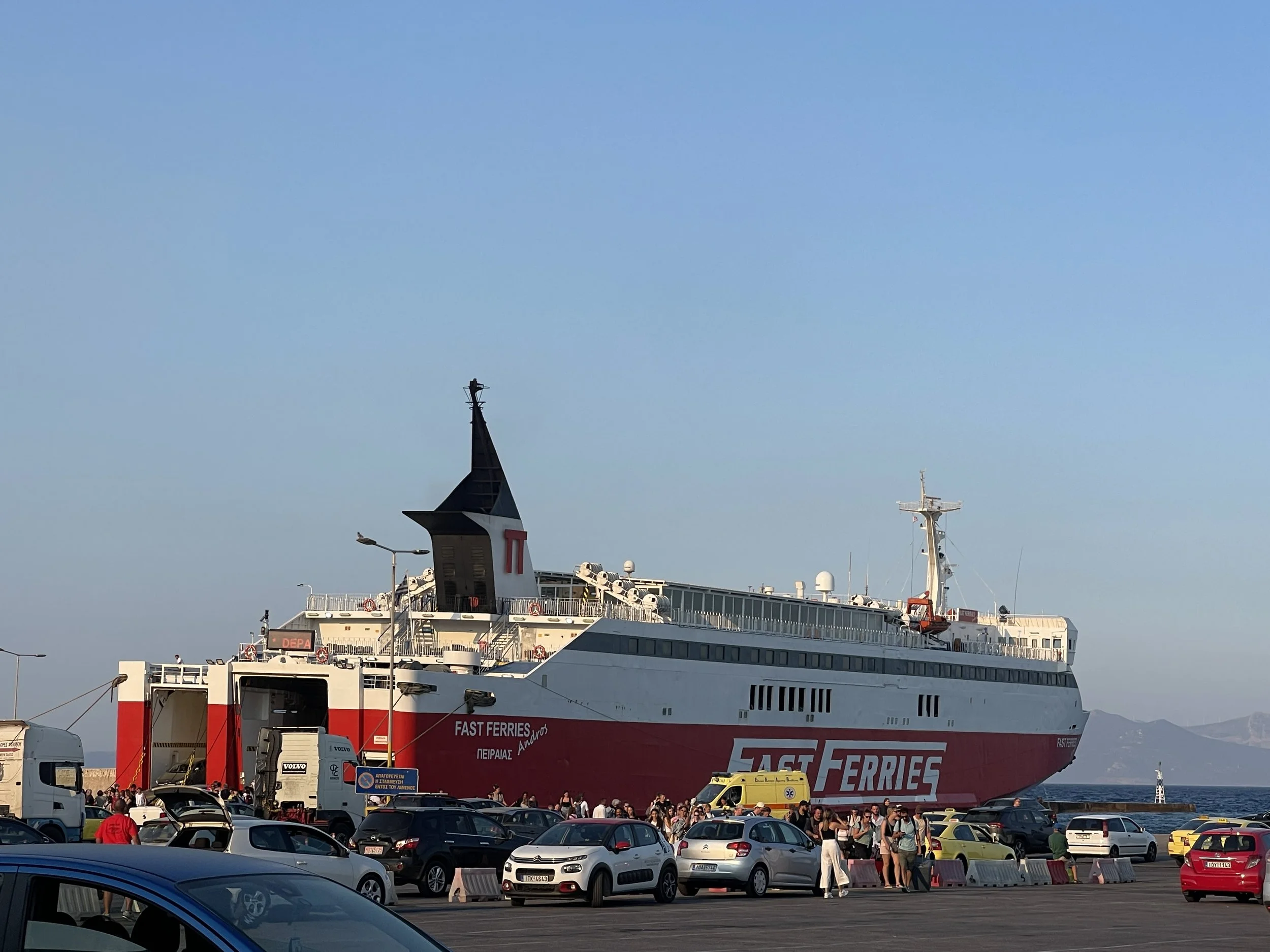 Fast Ferries red ferry docked.JPG