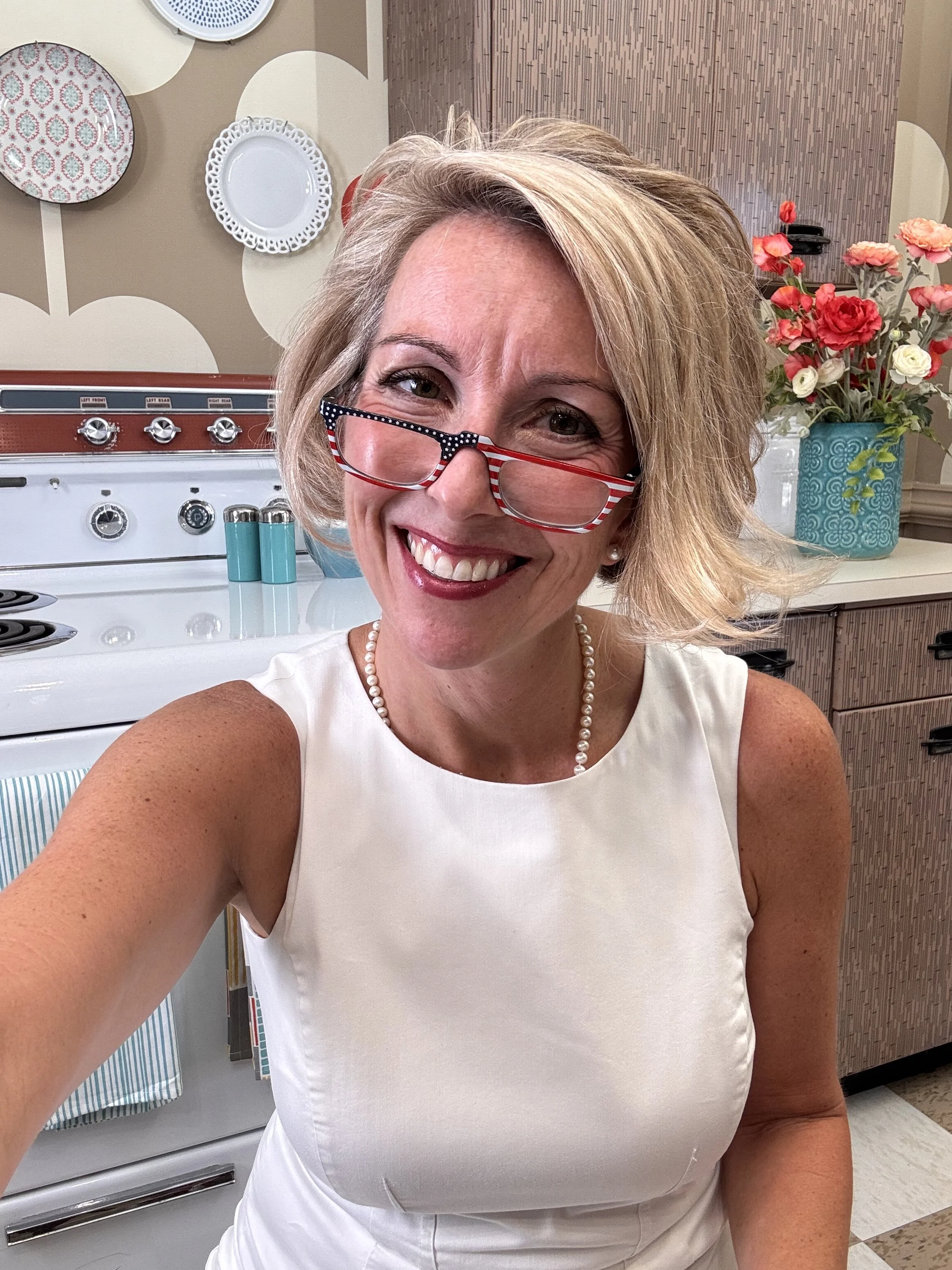 Leigh Brown in her podcast studio and real estate office in concord nc ready to serve your auction