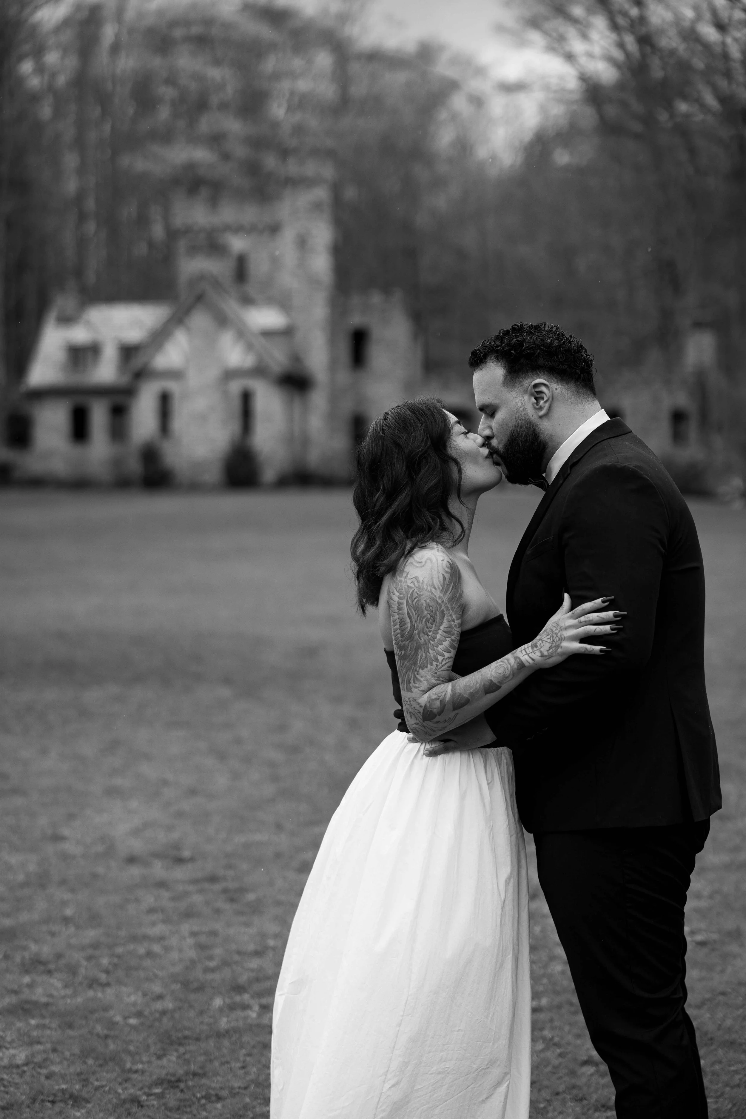 Portrait - Luis and Athena Kissing Close Castle Background.jpg