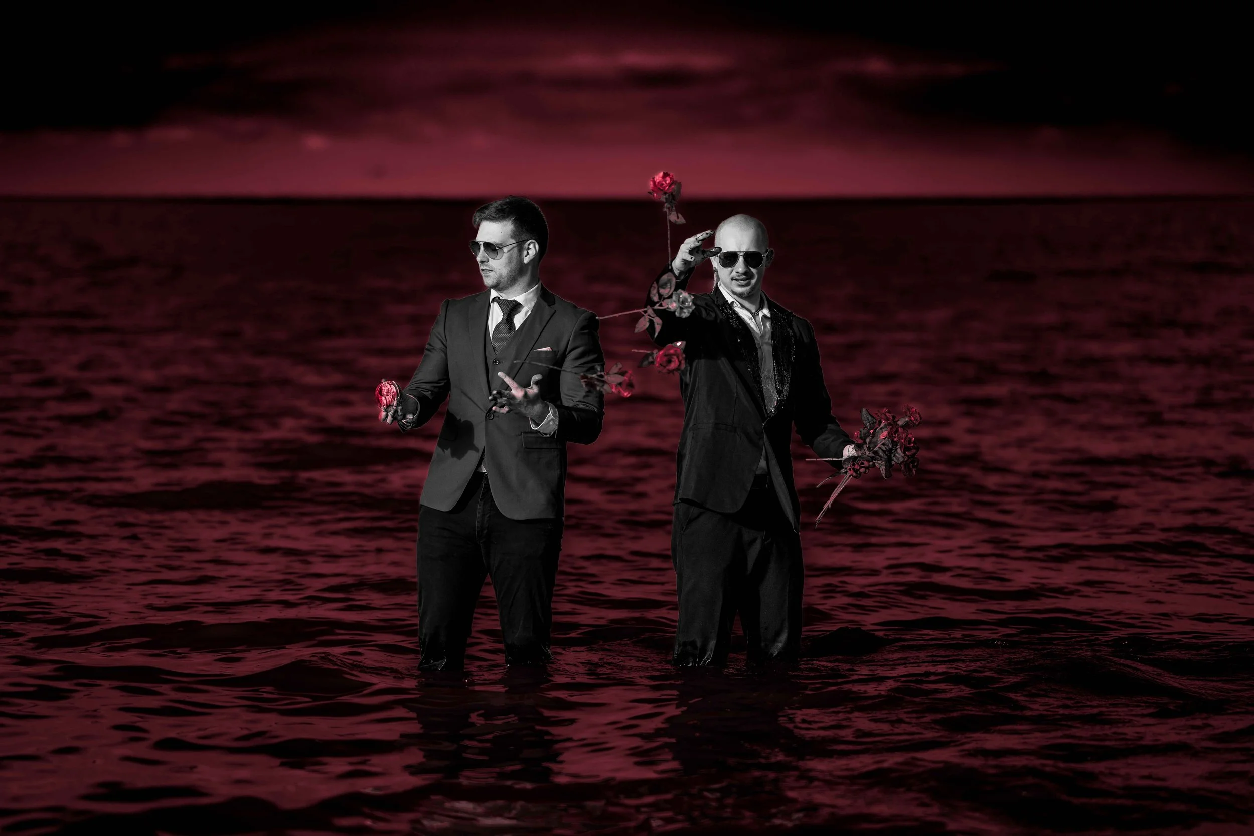 Kissing Lilith - Gavin and Cody in Red Water Throwing Roses.jpg