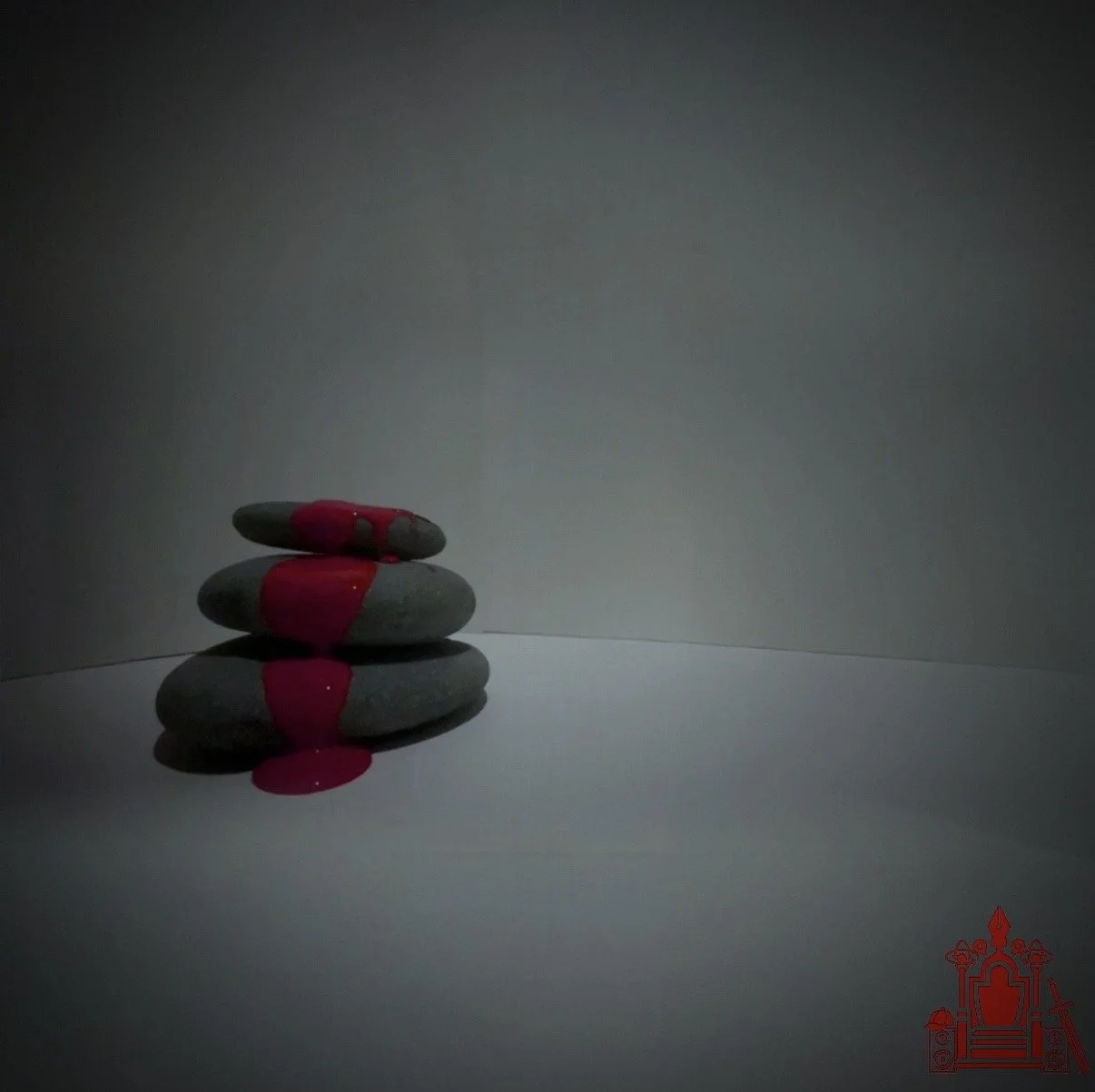 Mahjestes's first puzzle piece to his mixtape. It's three stones with red paint. this is the marker