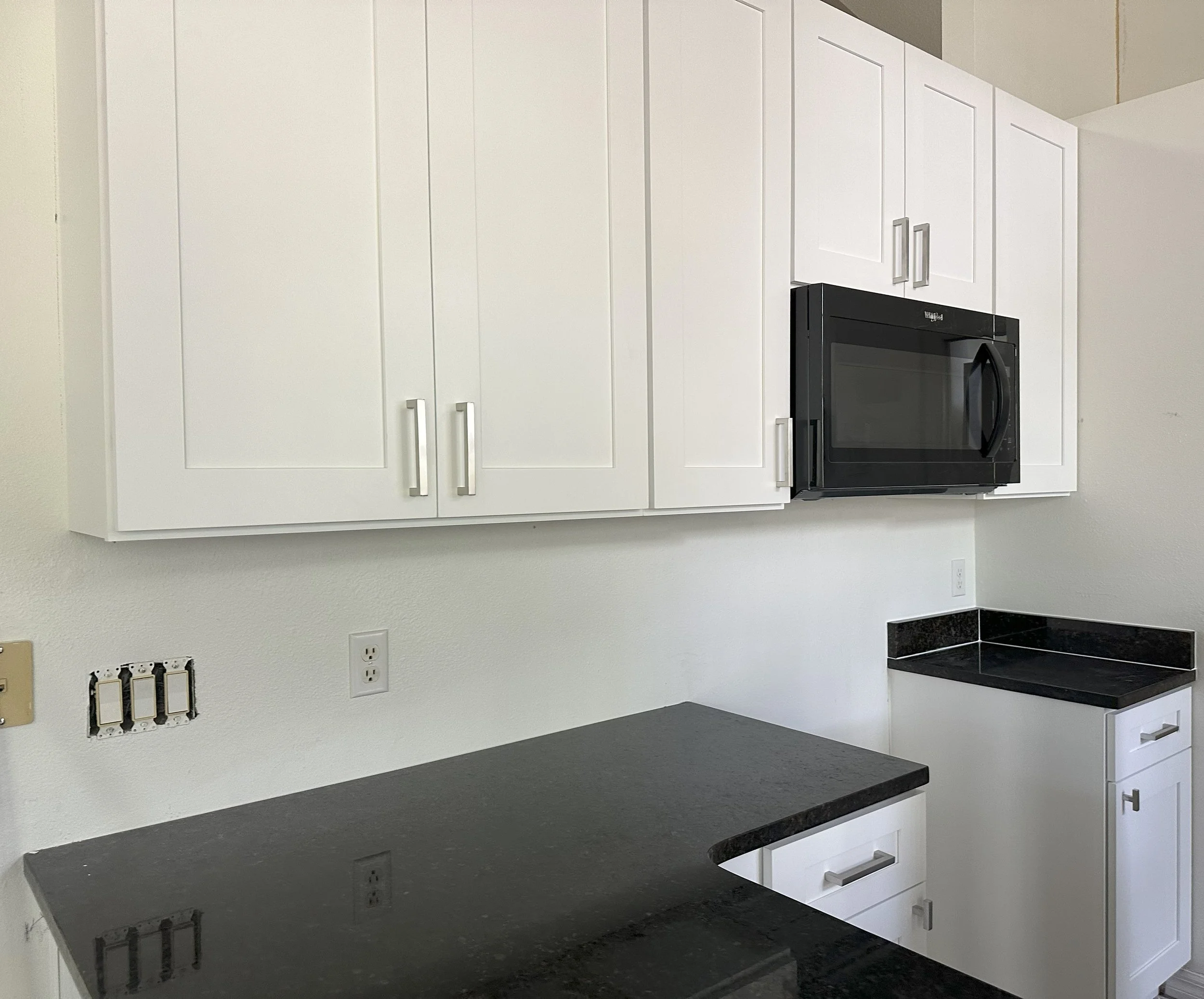 Cartoon illustration of a woman with shoulder-length brown hair, glasses, and a cheerful expression, wearing a cream-colored blouse and pink pants.