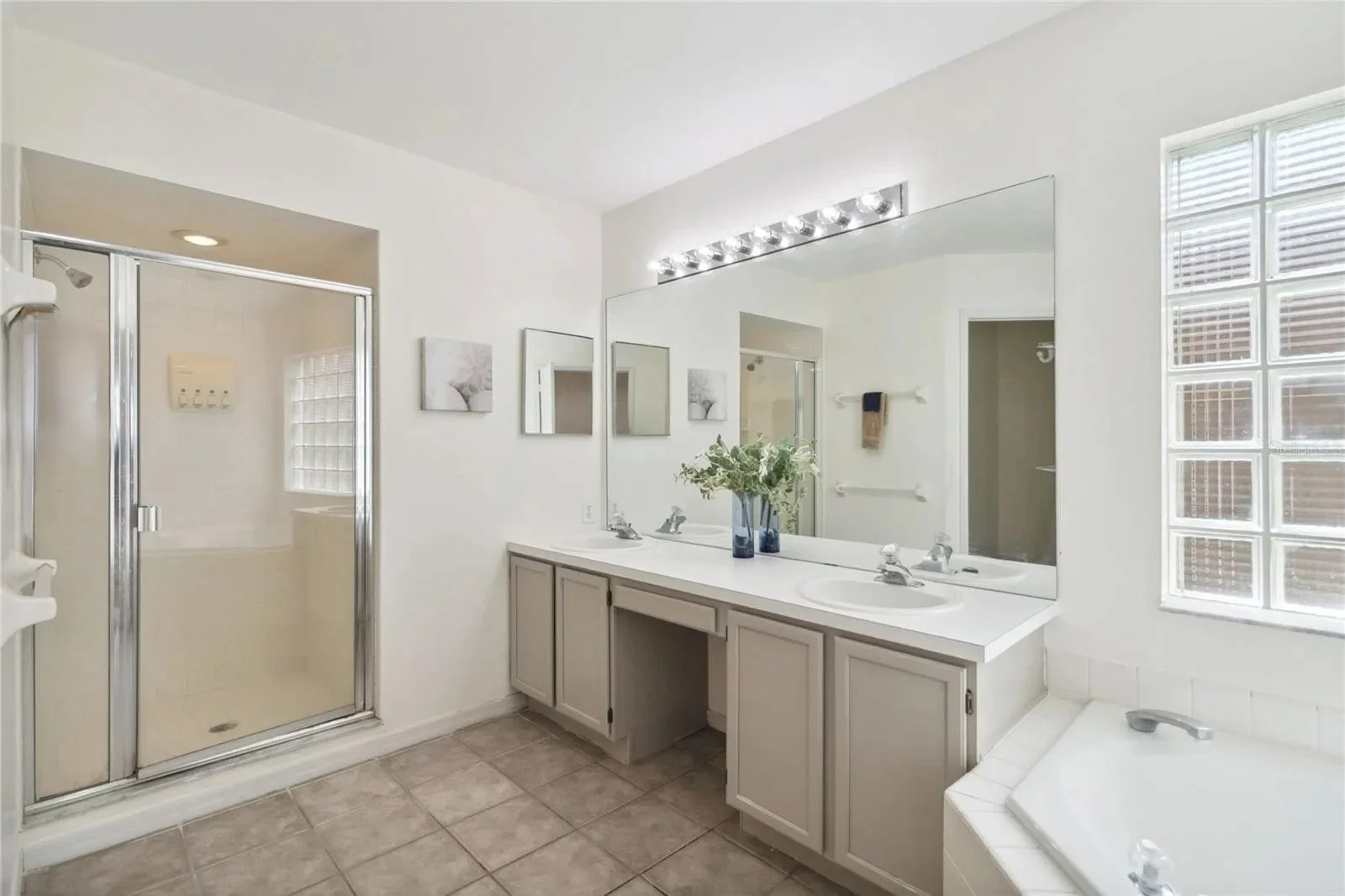 Cartoon illustration of a woman with shoulder-length brown hair, glasses, gold hoop earring, wearing a white shirt and pink tool belt, standing confidently with one hand in her pocket.