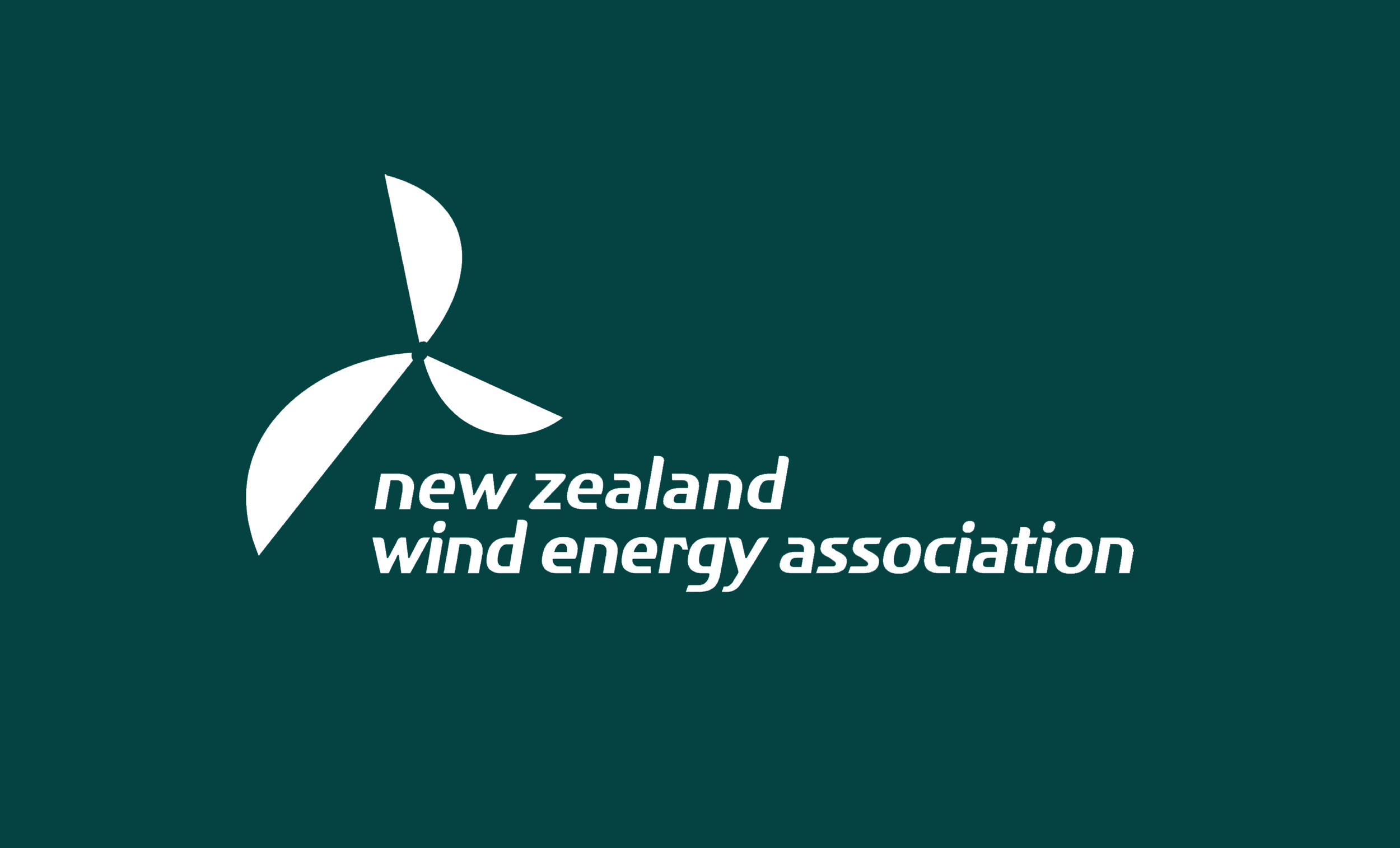 Logo of the New Zealand Wind Energy Association featuring a stylised wind turbine with three blades and the text 'new zealand wind energy association' in lowercase white font.
