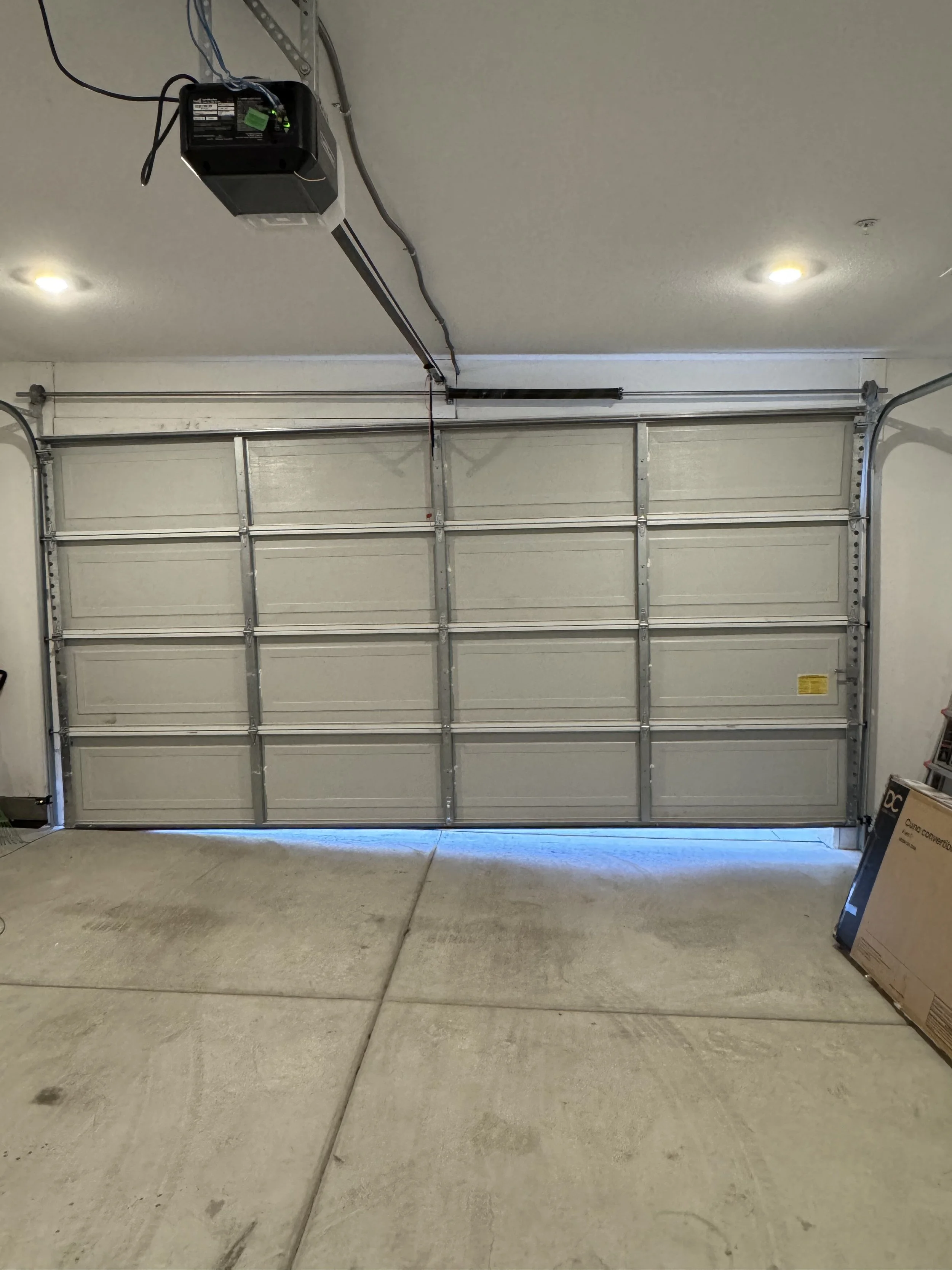 Why Your Garage Door Opens By Itself (Causes &amp; Fixes That Actually Work)