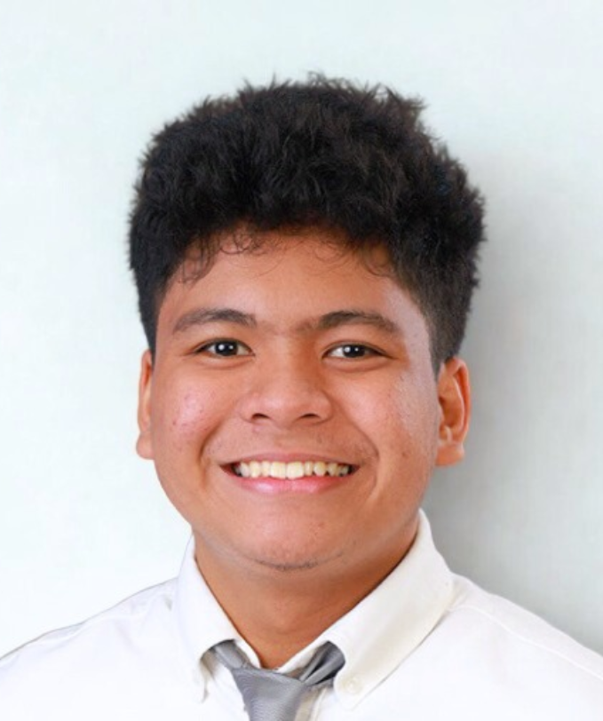 a man facing the camera while slightly leaning 