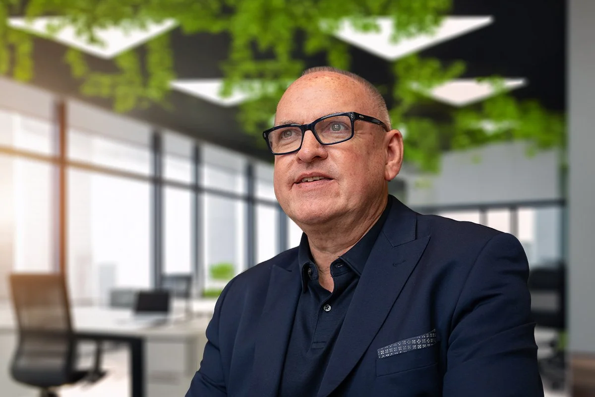 Kevin Dunckley with vibrant green office background. Inspiring and enrgised.