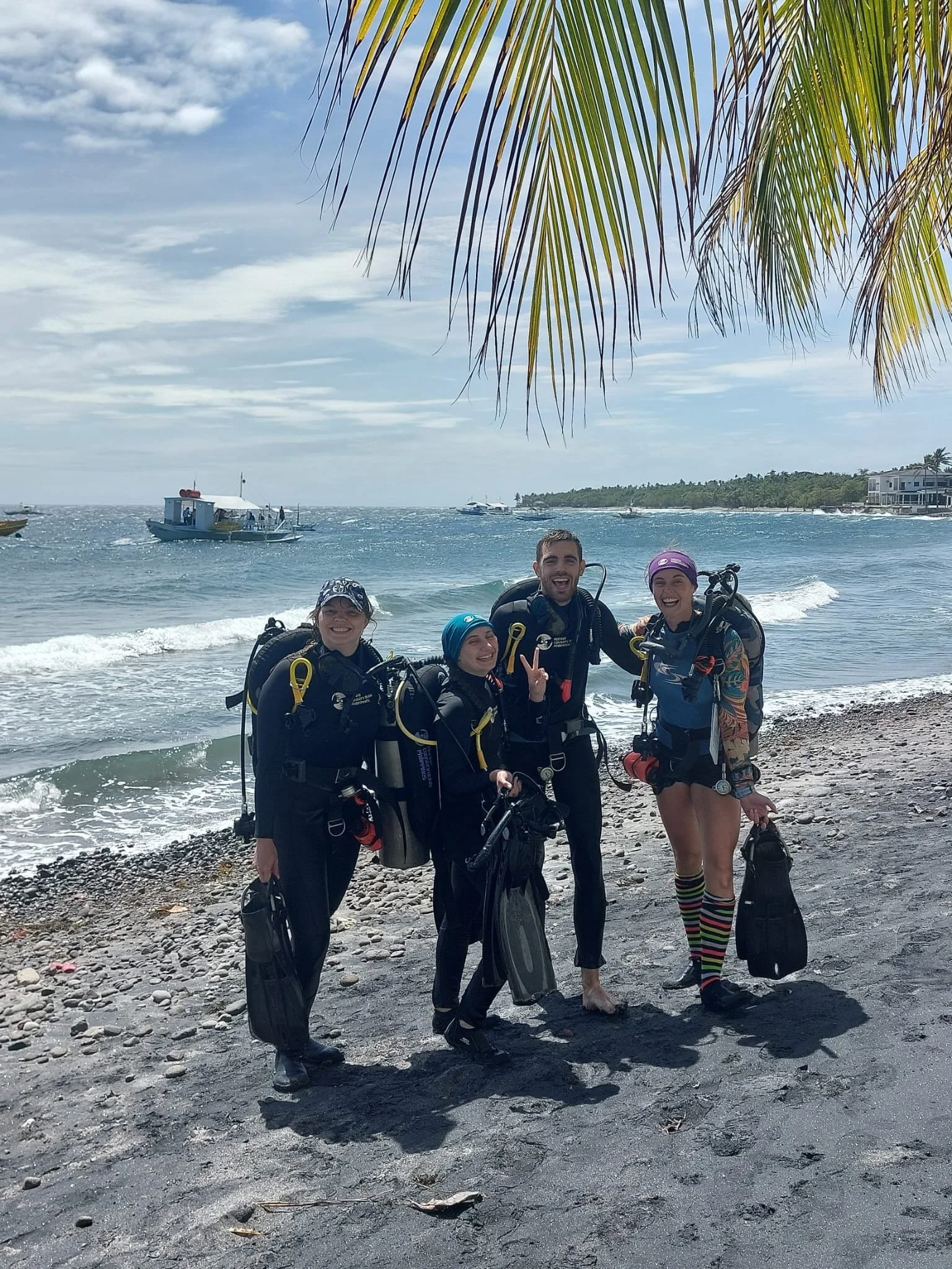 New open water divers dressed in full dive equipment