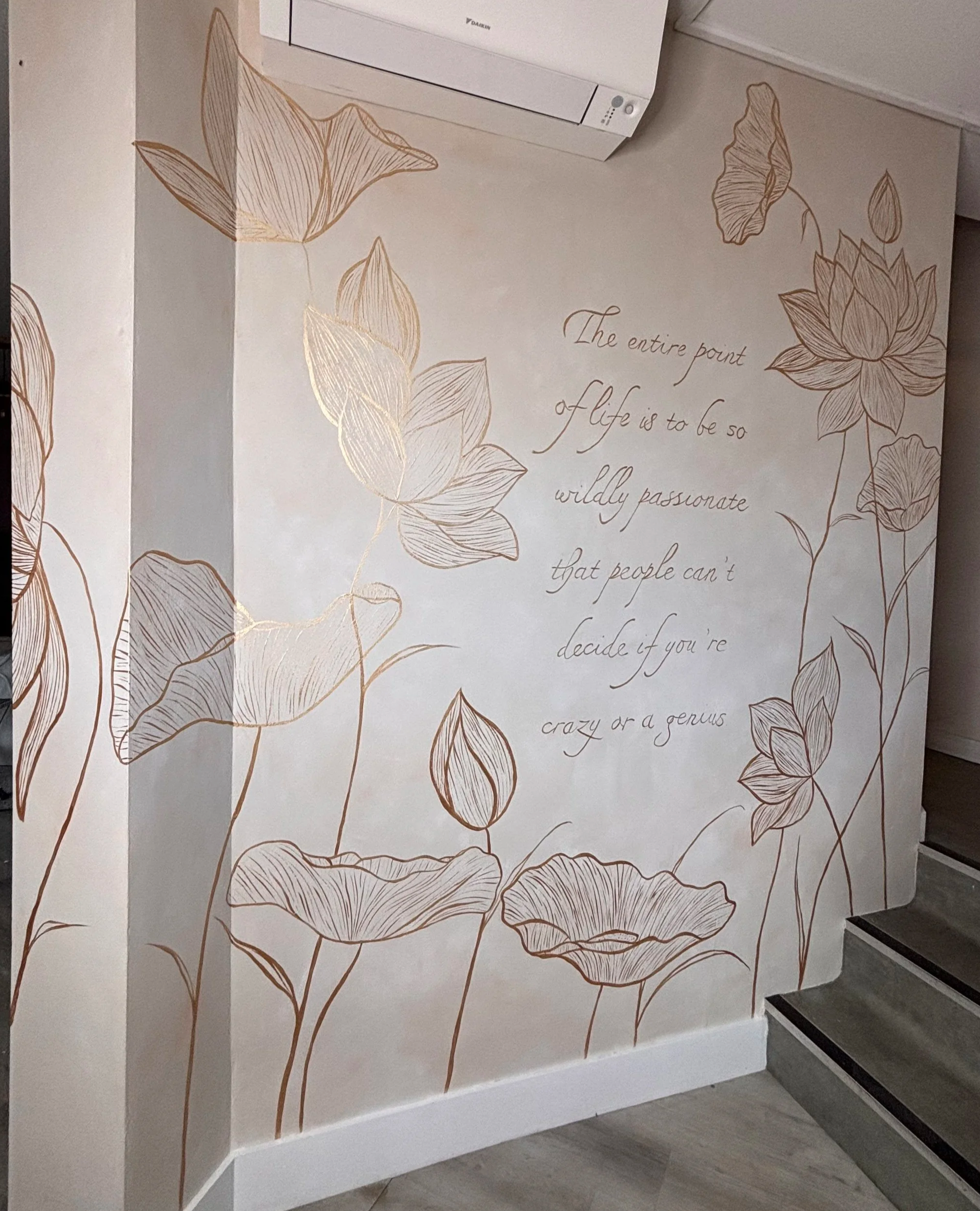 lotus mural, faux lime wash mural hertfordshire. Hertford muralist, mural artist based in Hitchin. line detail wall art. business mural. quote painted on to wall. gold artwork