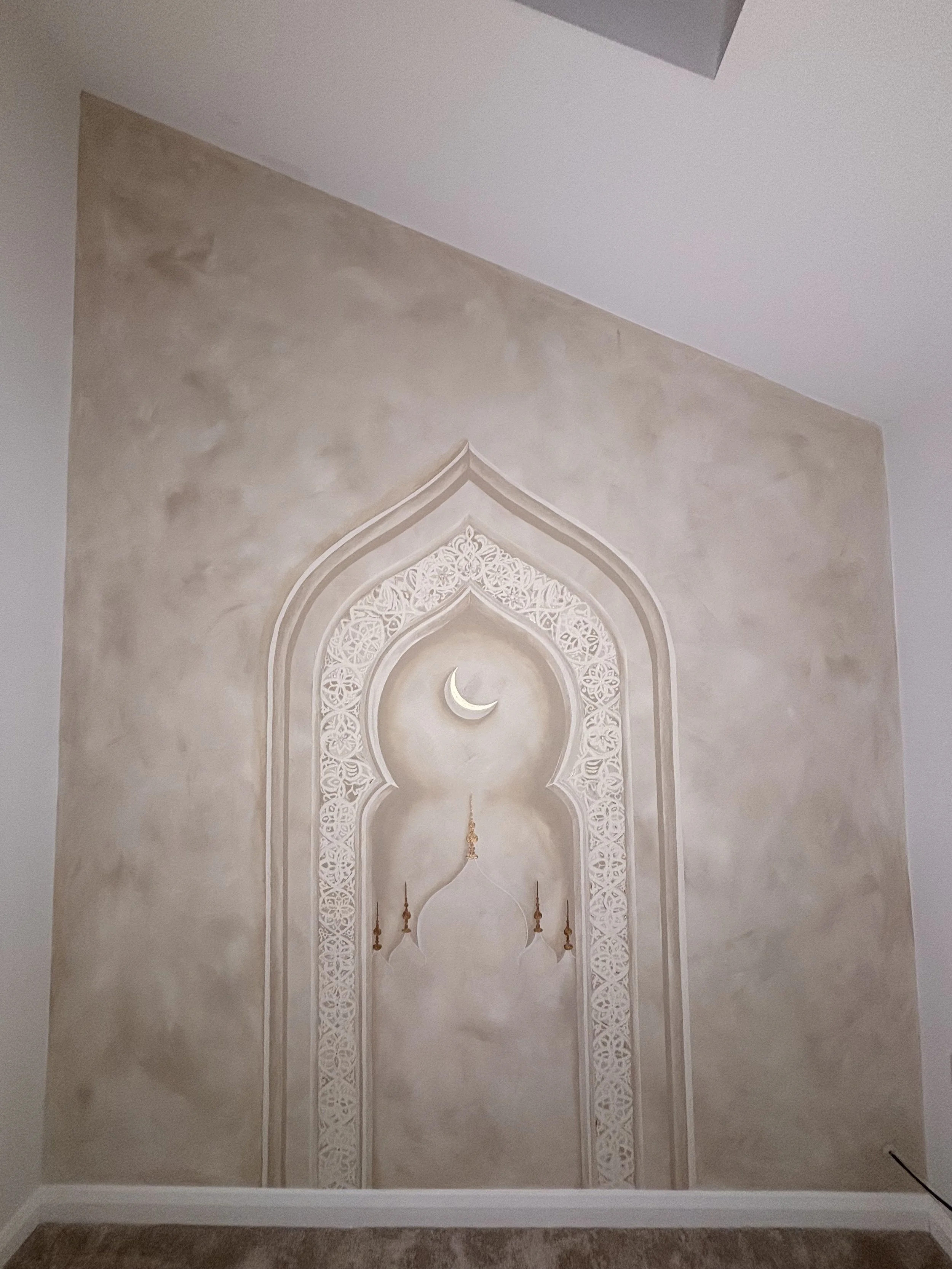 Elegant 3D prayer room mural featuring a sculpted Islamic archway, minimalist mosque design and crescent moon. A peaceful, bespoke wall mural creating depth and serenity in a Muslim prayer space.