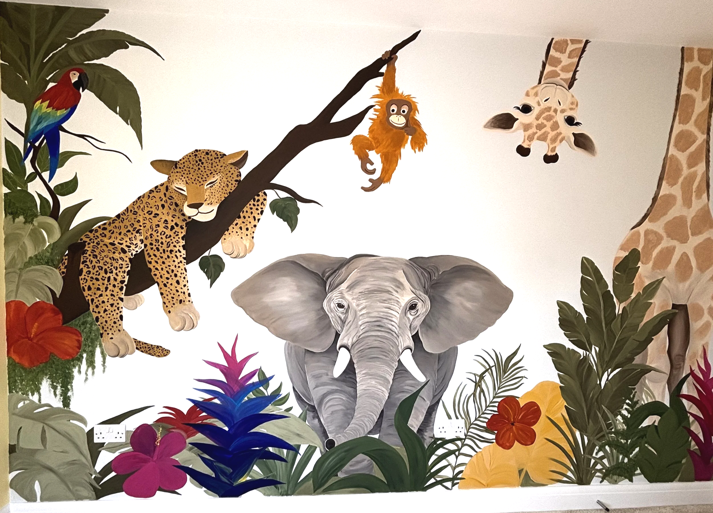 Jungle safari mural. children's bedroom wall art. baby room Inspo. Hertfordshire based muralist. artist based in Hertfordshire. giraffe painting. leopard art. jungle theme wall art. muralist with colourful paintings