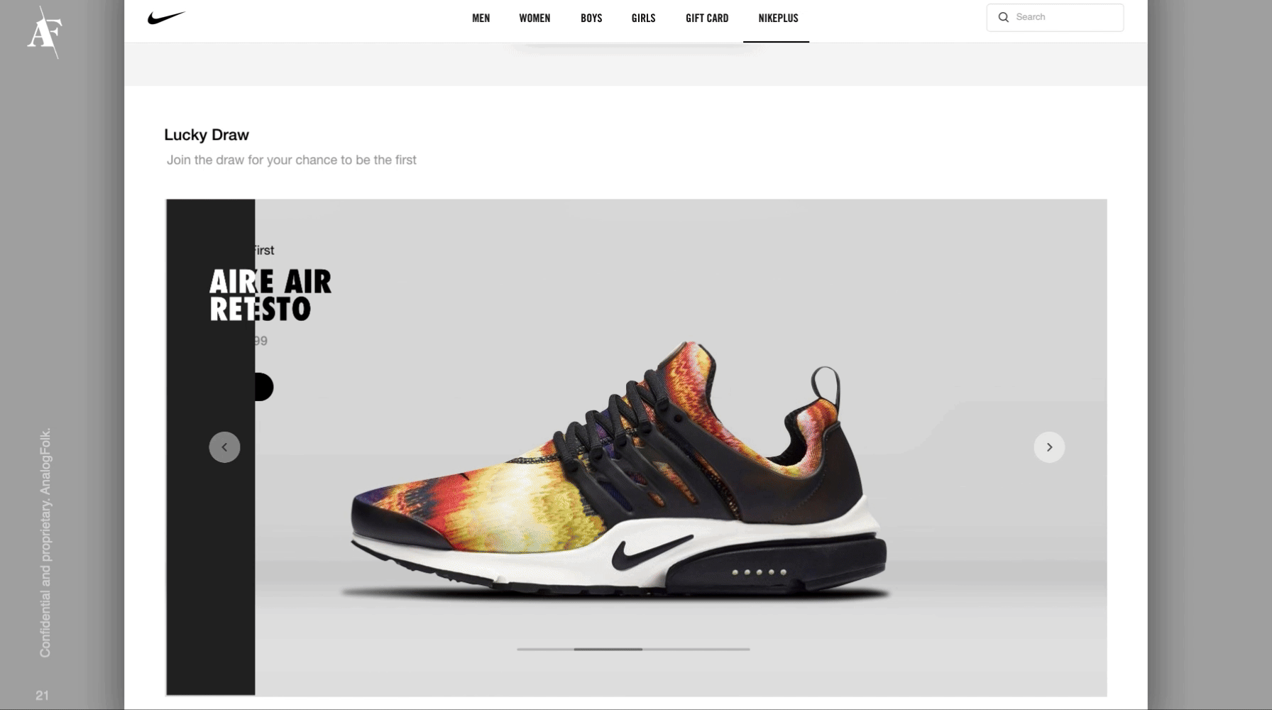 A colorful Nike running shoe with a cloud-like pattern in shades of yellow, orange, and black, featuring black laces, a black Nike swoosh, and a white midsole against a plain gray background.