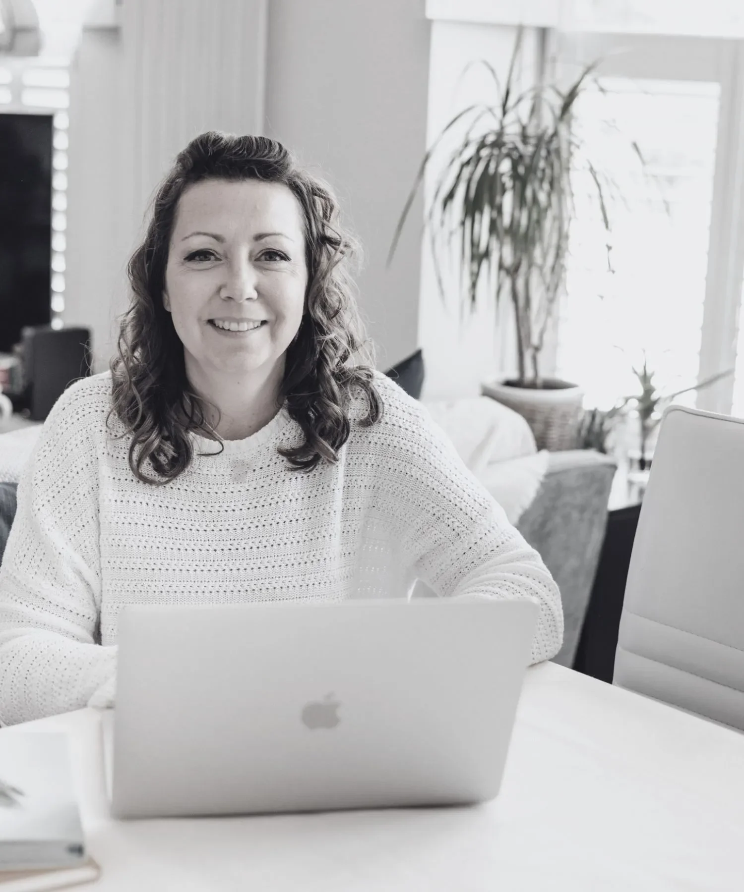 Sammy Phillips sat with laptop designing website templates
