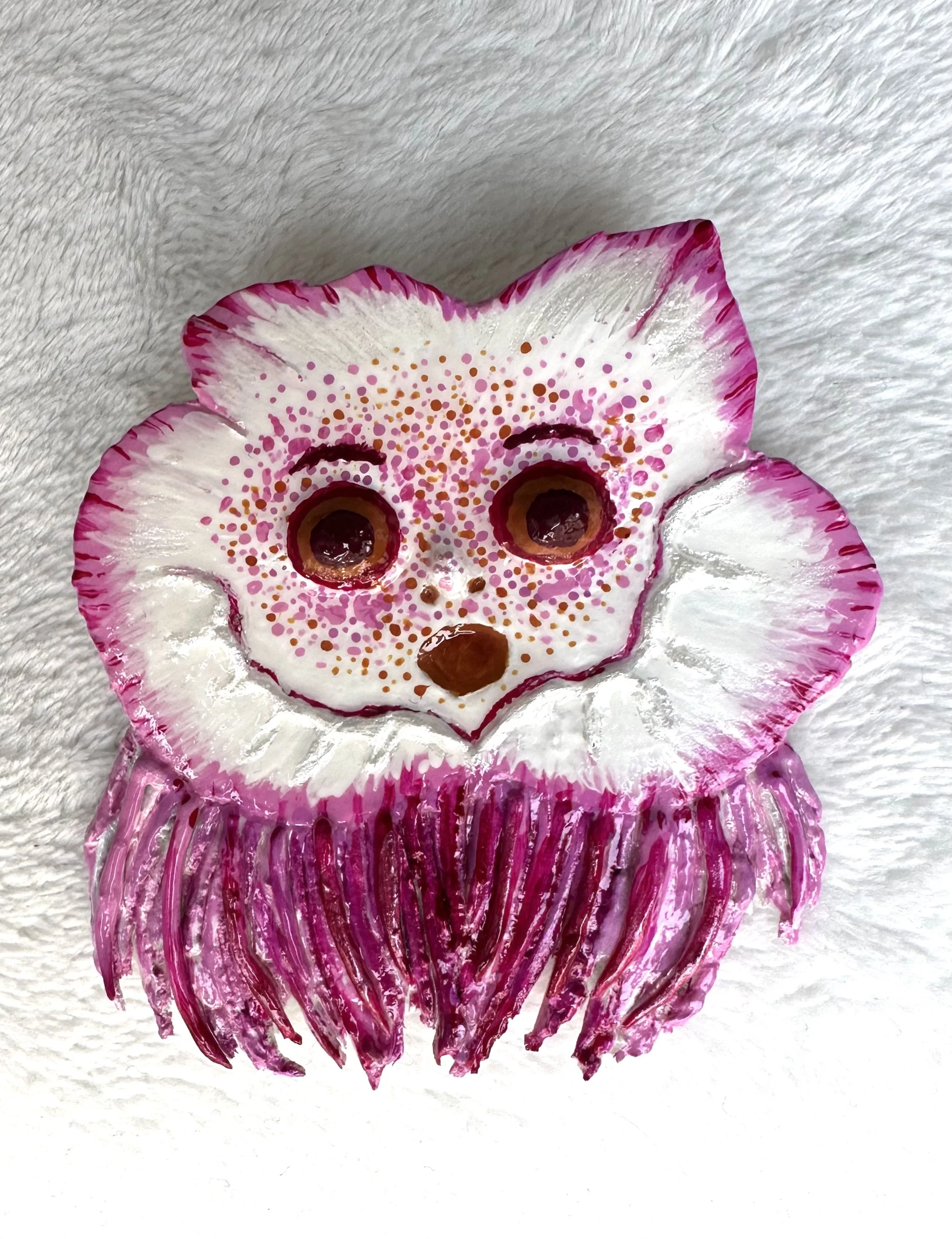 face brooch