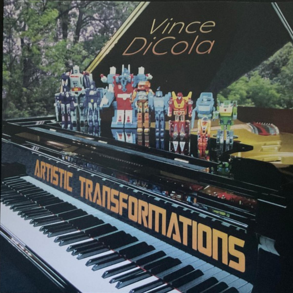 Artistic Transformations front cover — Transformers figures on Vince DiCola's grand piano (photo: Jon Hartman)